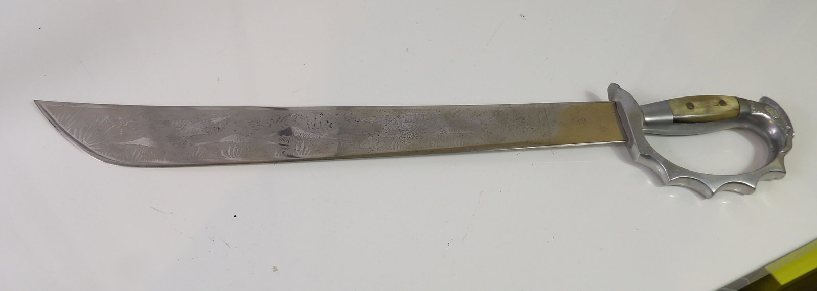 Sword with Knuckle Guard: Butterfly Sword with Knuckle Guard. All measurements approximate. Please see photos for condition and details. Selling as is from 04281.