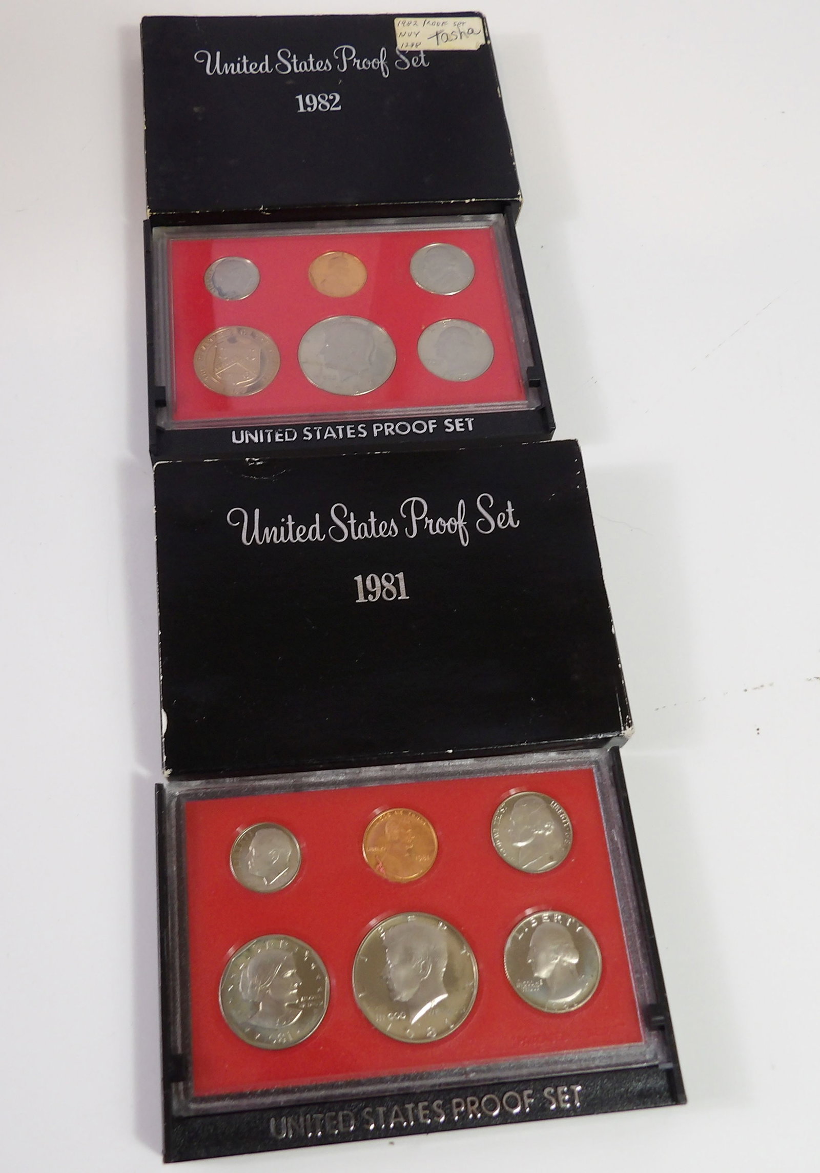 1981 & 1982 U.S. Mint Proof Sets: 2 United States Mint Proof Sets, 1981 and 1982. All measurements approximate. Please see photos for condition and details. Selling as is from 04281.