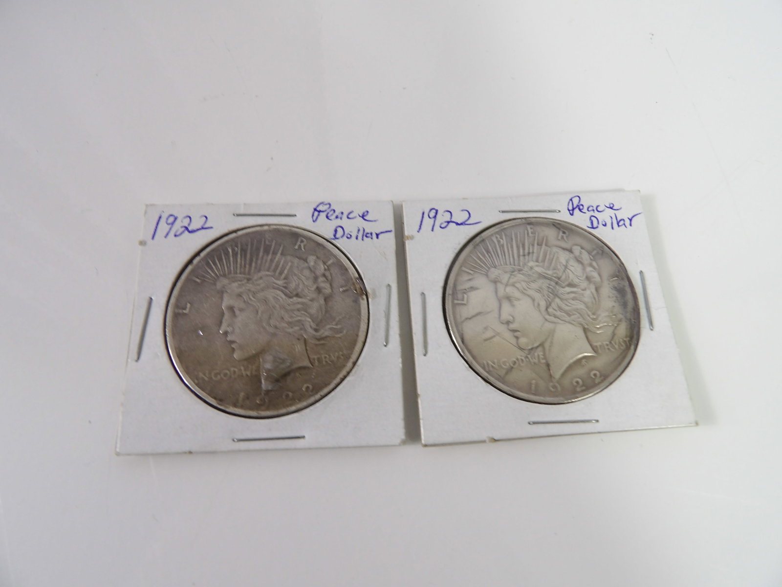 2 1922 Peace Dollars: Set of 2, 1922 Peace Dollars. All measurements approximate. Please see photos for condition and details. Selling as is from 04281.