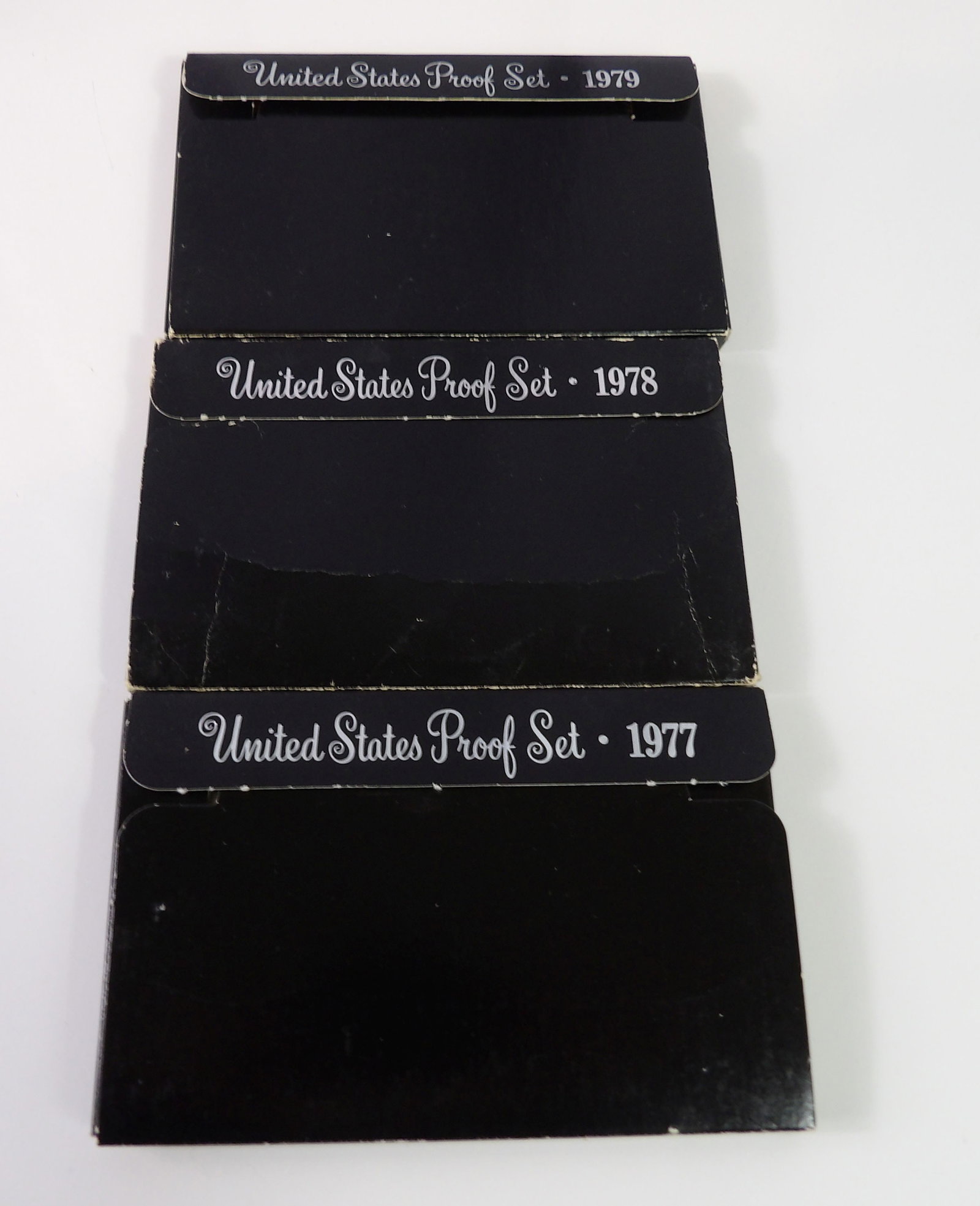 1977, 1978, & 1979 United States Proof Sets: 3 United States Proof Sets for 1977, 1978, and 1979. All measurements approximate. Please see photos for condition and details. Selling as is from 04281.