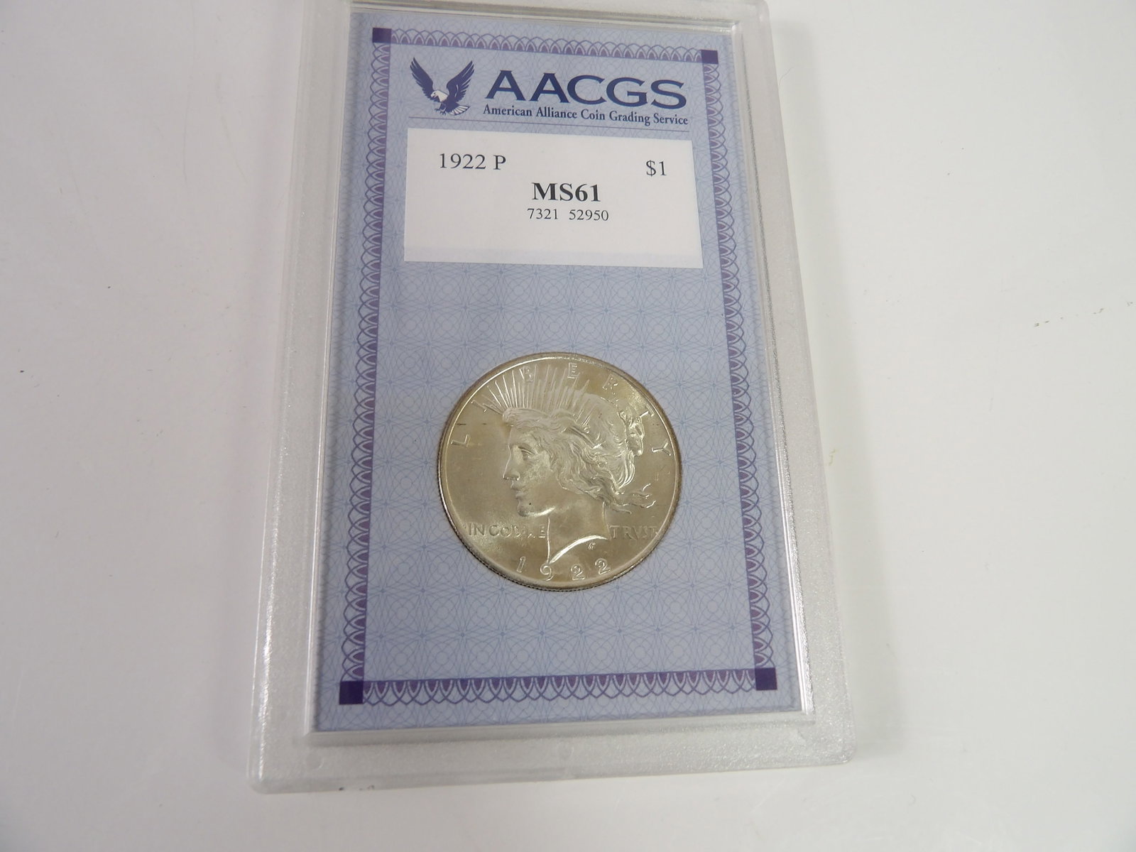 1922 Peace Dollar, Slabbed & Graded by American Alliance Coin Grading Service: 1922 Peace Dollar, MS61, Graded by American Alliance Coin Grading Service. All measurements approximate. Please see photos for condition and details. Selling as is from 04281.