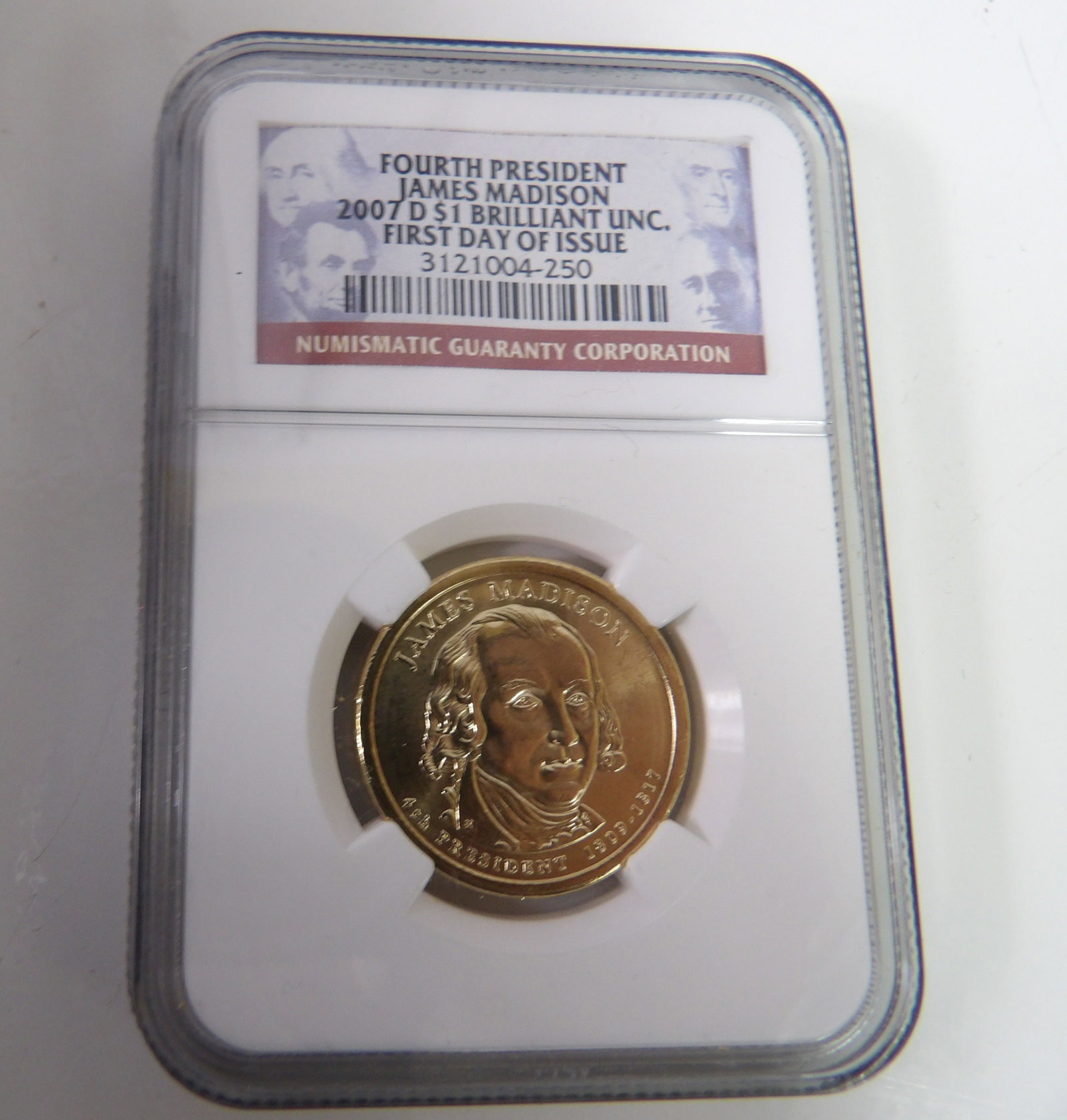 2007D James Madison First Day of Issue $1 Coin, Slabbed & Graded by NGC: James Madison 2007D, Brilliant Uncirculated, First Day of Issue $1 Coin, NGC Graded. All measurements approximate. Please see photos for condition and details. Selling as is from 04281.