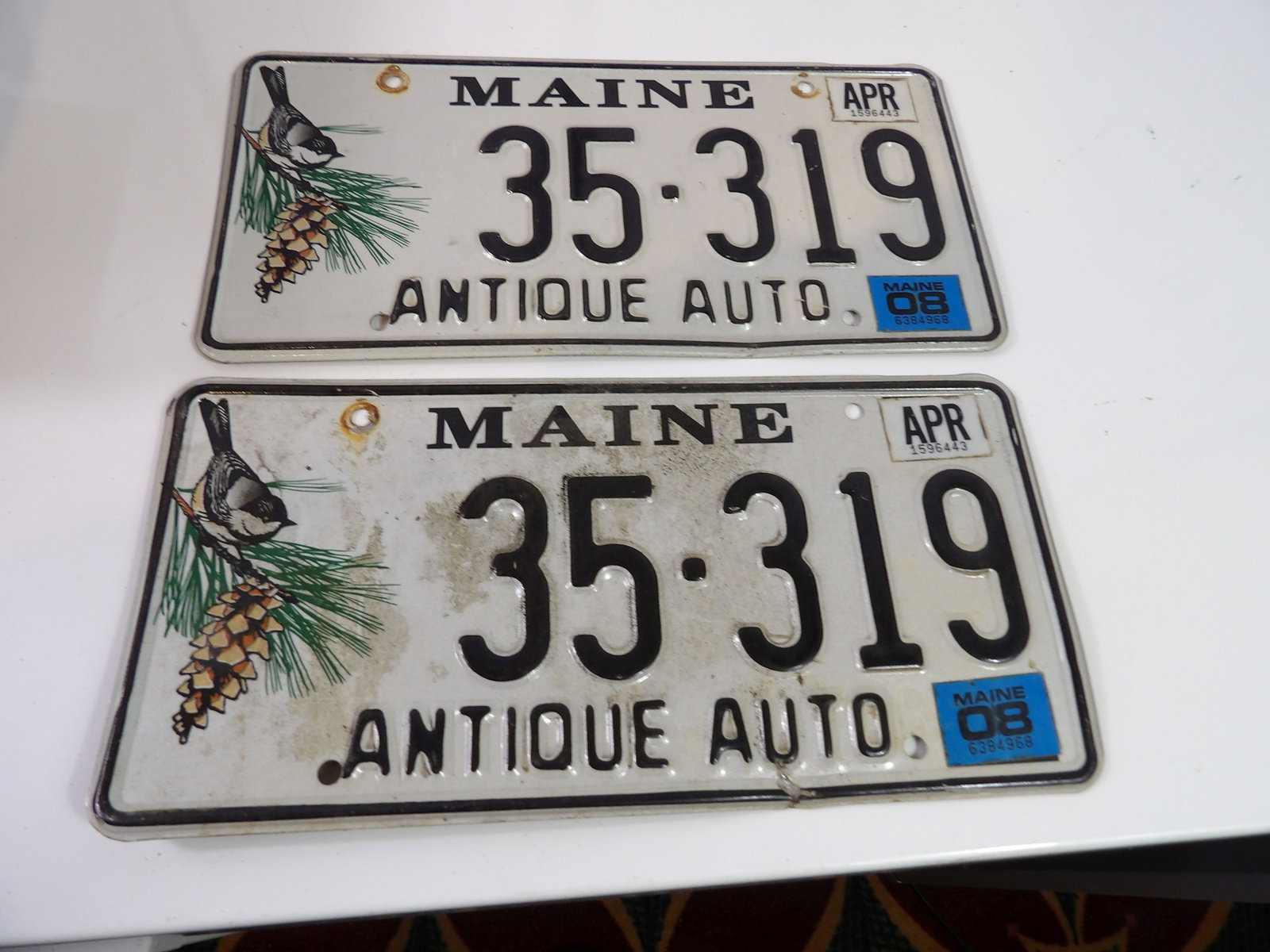 Pair of Chickadee Maine Antique Auto Plates: Pair of Chickadee Maine Antique Auto Plates. All measurements approximate. Please see photos for condition and details. Selling as is from 04281.