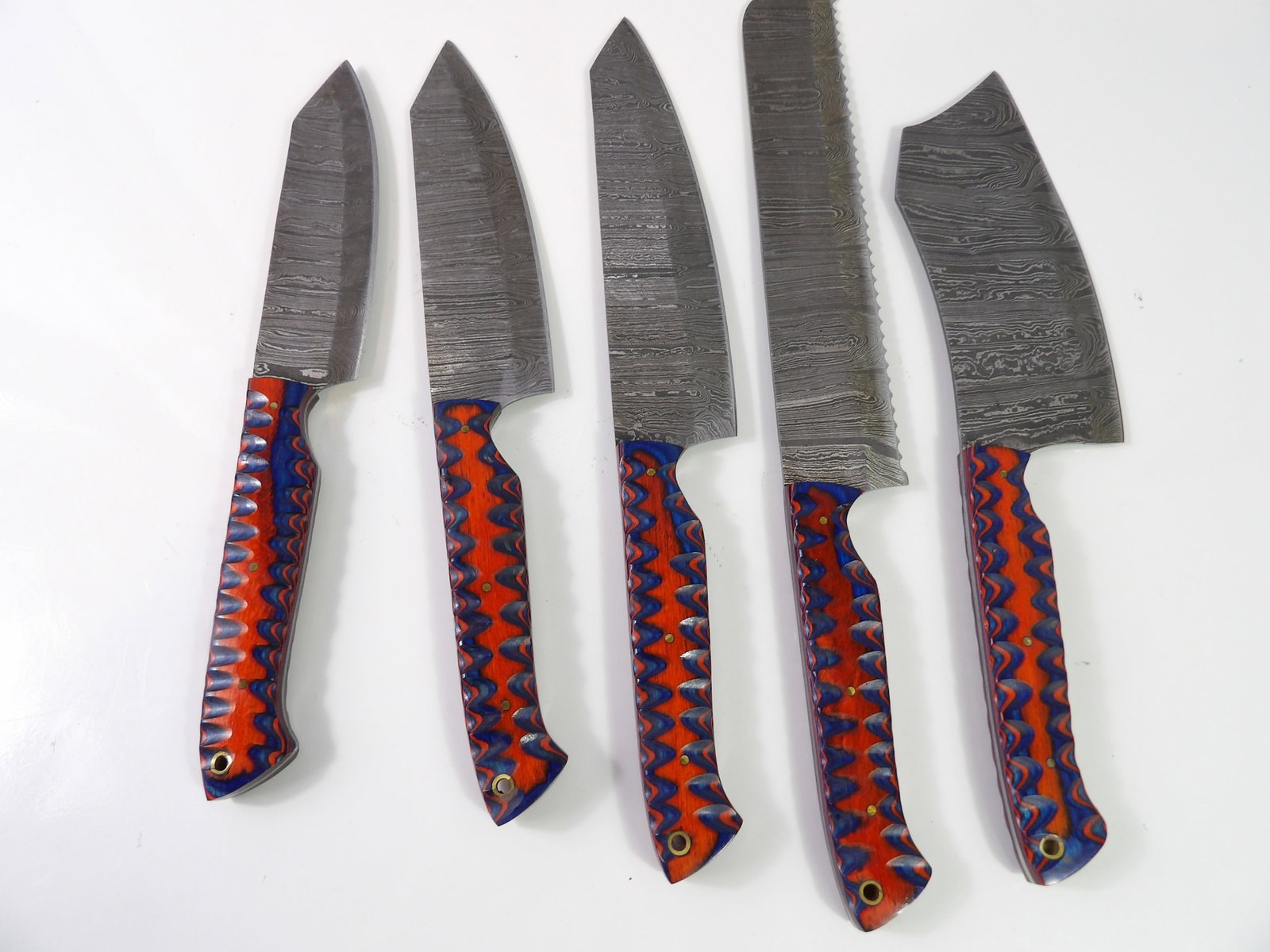 5 Handmade Damascus Steel Kitchen Knives: Set of 5 Handmade Damascus Steel Kitchen Knives with Wooden Handles, New. All measurements approximate. Please see photos for condition and details. Selling as is from 04281.