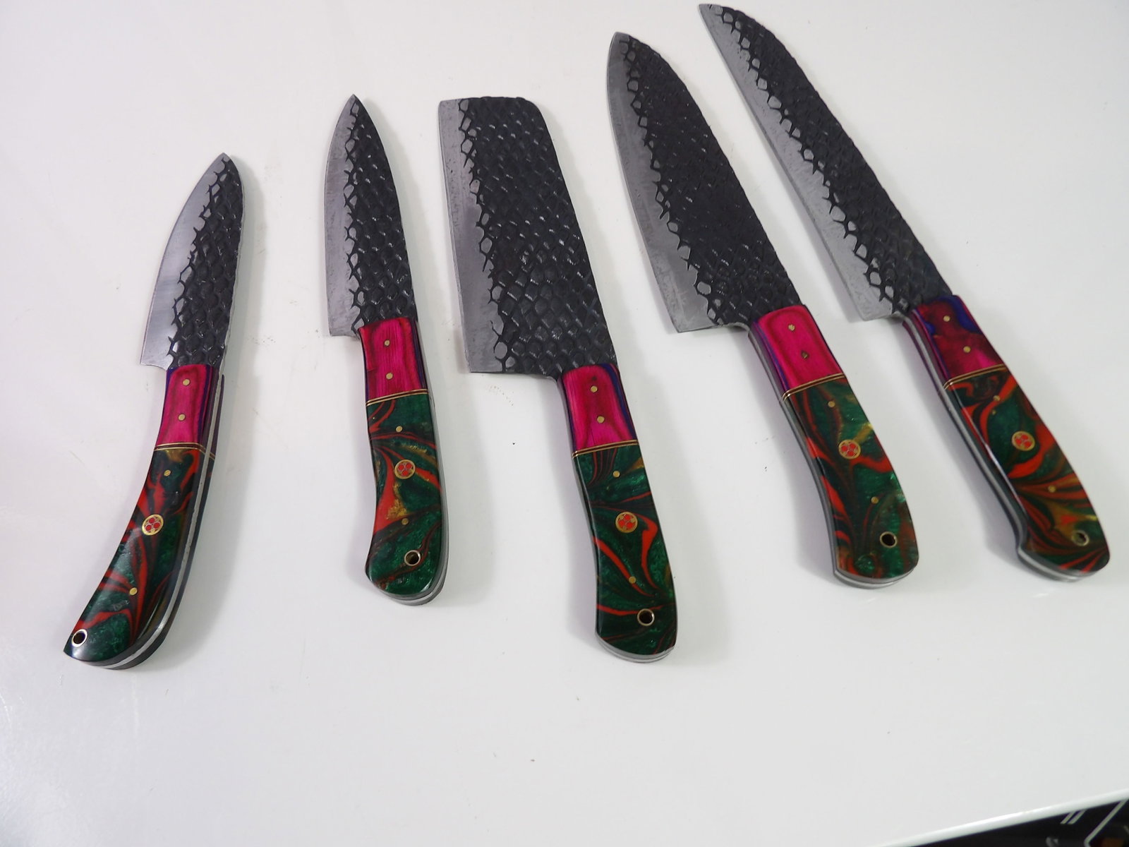 5 Handmade Damascus Steel Kitchen Knives: Set of 5 New Handmade Steel Kitchen Knives. All measurements approximate. Please see photos for condition and details. Selling as is from 04281.
