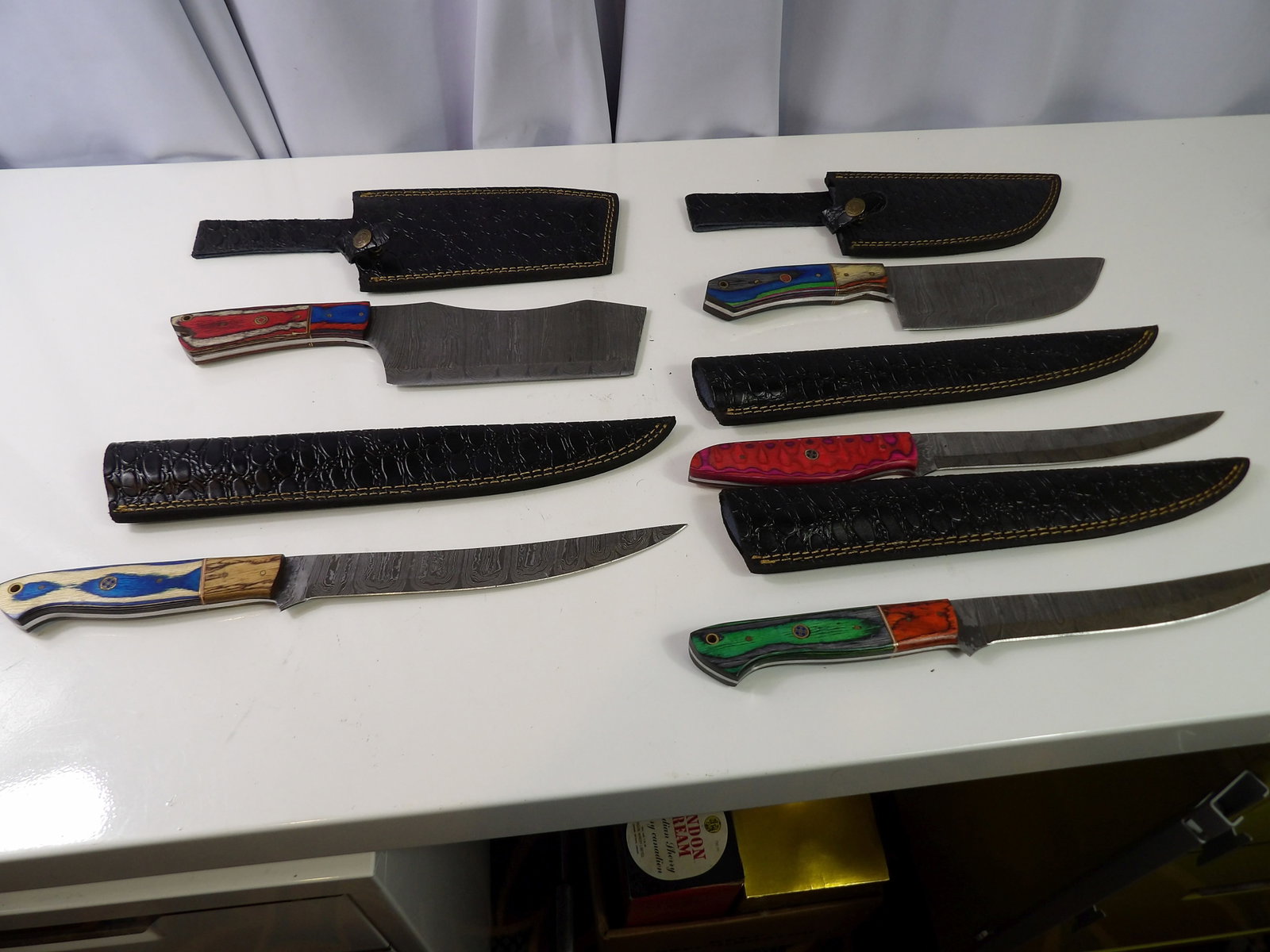 5 Large Handmade Damascus Steel Knives With Sheaths: Lot of 5 Large Handmade Damascus Steel Knives with Leather Sheaths. All measurements approximate. Please see photos for condition and details. Selling as is from 04281.