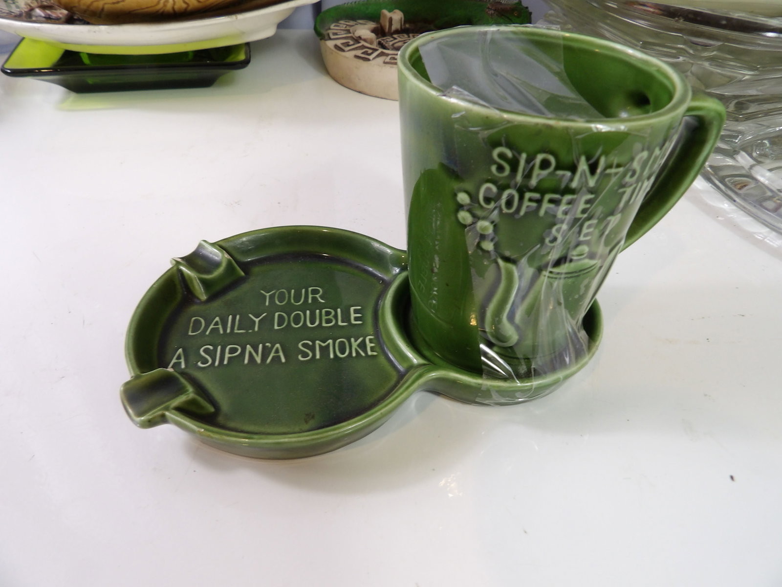 Vintage Sip N Smoke Coffee Time Set: Vintage Sip N Smoke Coffee Time Set. Green Ceramic Mug and Ashtray. All measurements approximate. Please see photos for condition and details. Selling as is from 04281.