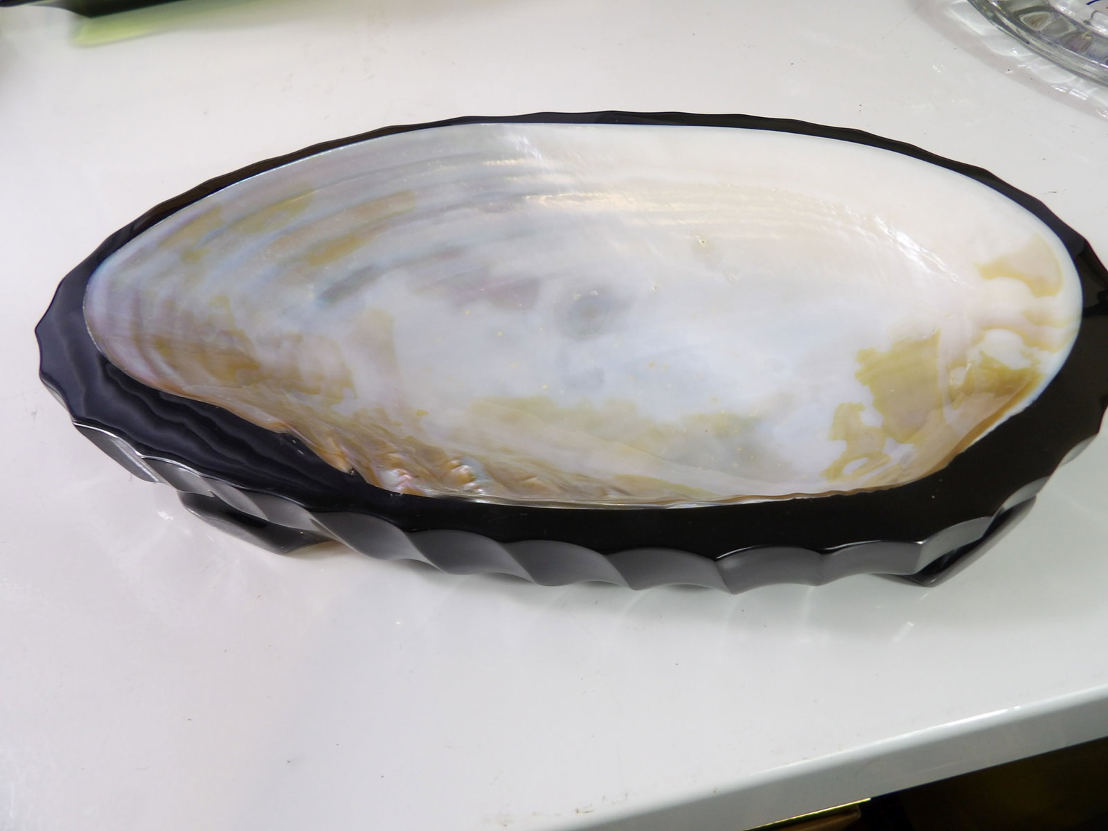 Blacklip Pearl Oyster Shell Ashtray: Blacklip Pearl Oyster Shell Ashtray from Vietnam, 11" Long. All measurements approximate. Please see photos for condition and details. Selling as is from 04281.