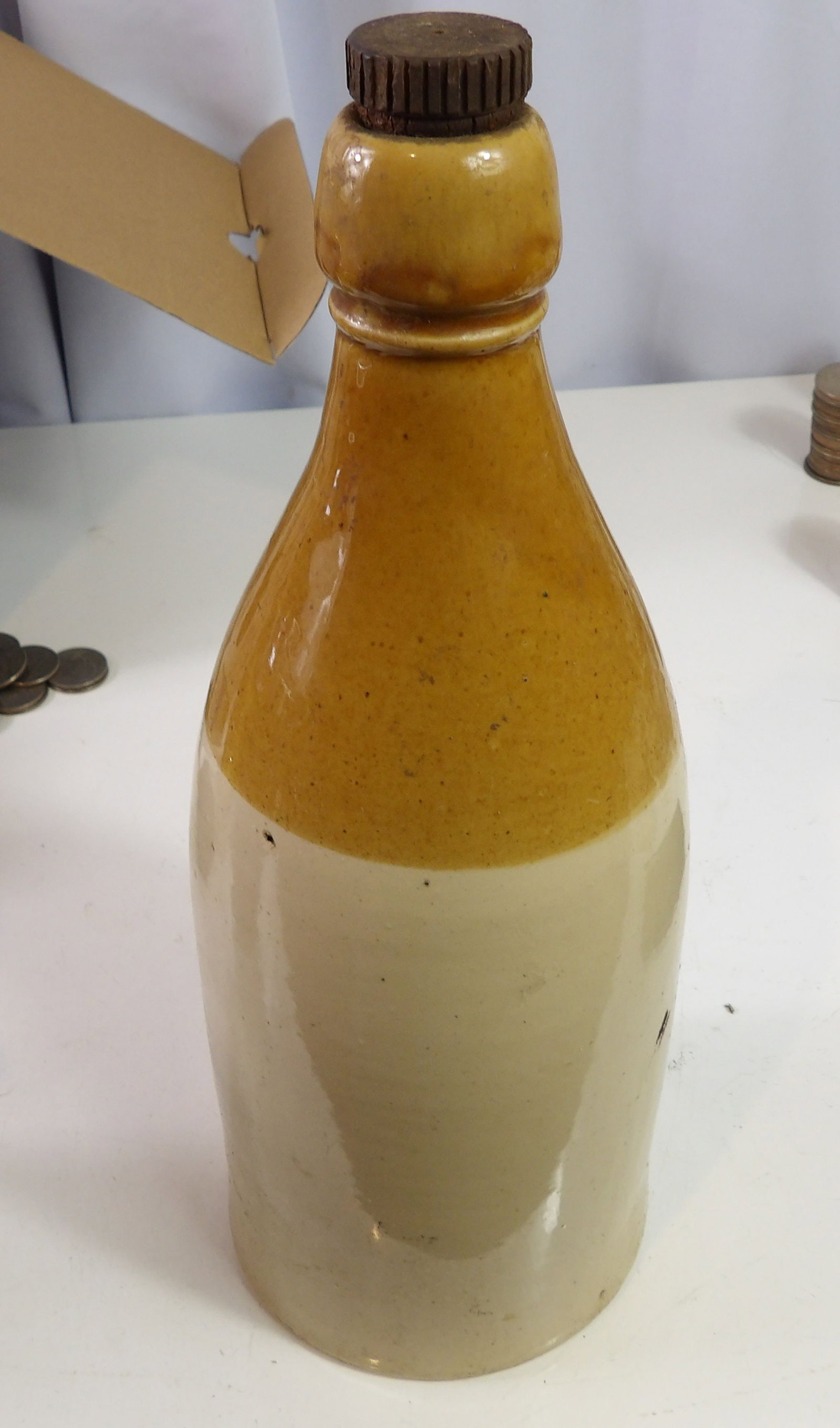 Two-Toned Stoneware Ginger Beer Bottle: Vintage Two-Toned Stoneware Ginger Beer Bottle. All measurements approximate. Please see photos for condition and details. Selling as is from 04281.