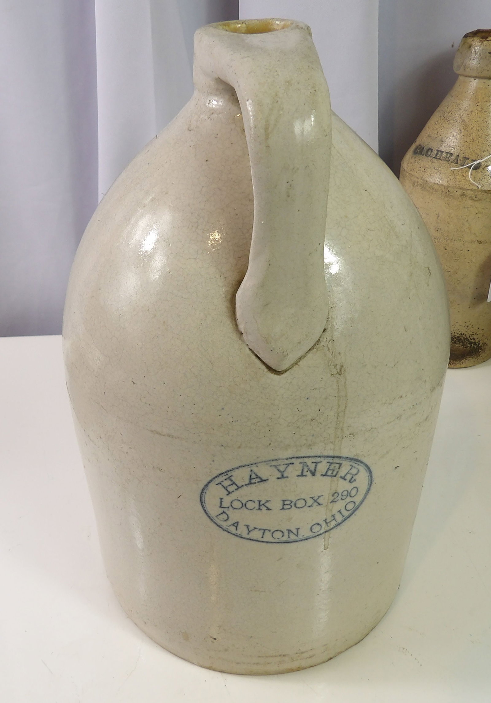 Bristol Glazed Hayner, Dayton, Ohio Stoneware Jug: Bristol Glazed Hayner, Dayton, Ohio Stoneware Jug. All measurements approximate. Please see photos for condition and details. Selling as is from 04281.