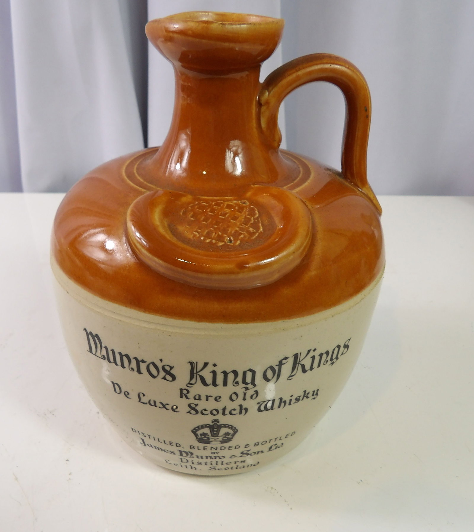Vintage Munro's King of Kings Scotch Whiskey Jug: Vintage Munro's King of Kings Scotch Whiskey Jug. All measurements approximate. Please see photos for condition and details. Selling as is from 04281.