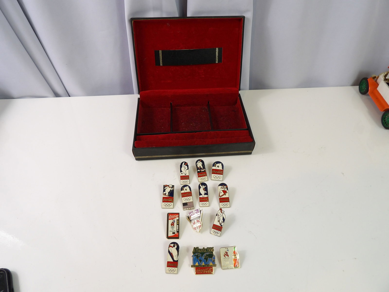 13 Coca Cola Olympic Pins: Collection of 13 Coca Cola Olympic Pins. All measurements approximate. Please see photos for condition and details. Selling as is from 04281.