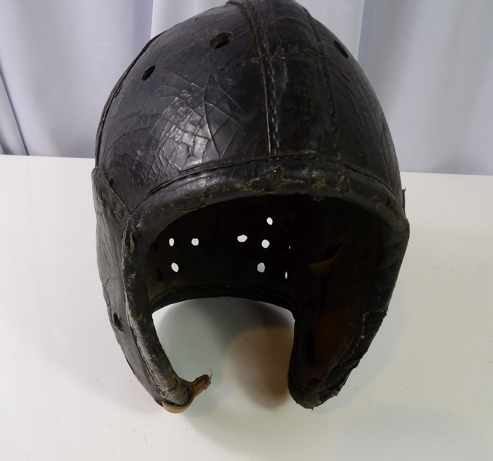 Vintage Leather Football Helmet, 1930's/40's: Vintage Leather Football Helmet, Likely 1930's-1940's. All measurements approximate. Please see photos for condition and details. Selling as is from 04281.
