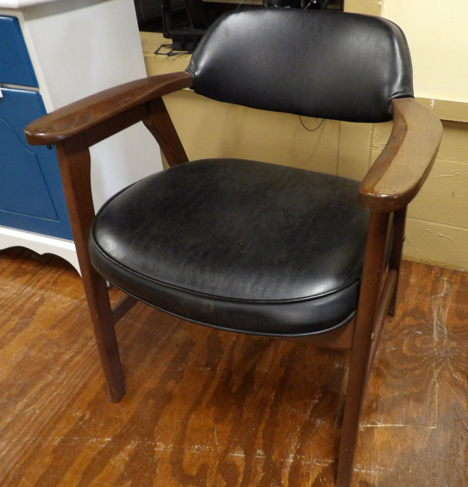 Mid-Century Modern Armchair: Mid-Century Modern Armchair with Black Leather. All measurements approximate. Please see photos for condition and details. Selling as is from 04281.