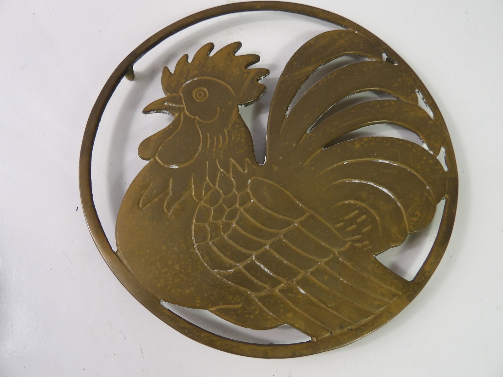 Large Vintage Brass RoosterTrivet: Large Vintage Brass Rooster Trivet, 7 1/2" Diameter. All measurements approximate. Please see photos for condition and details. Selling as is from 04281.