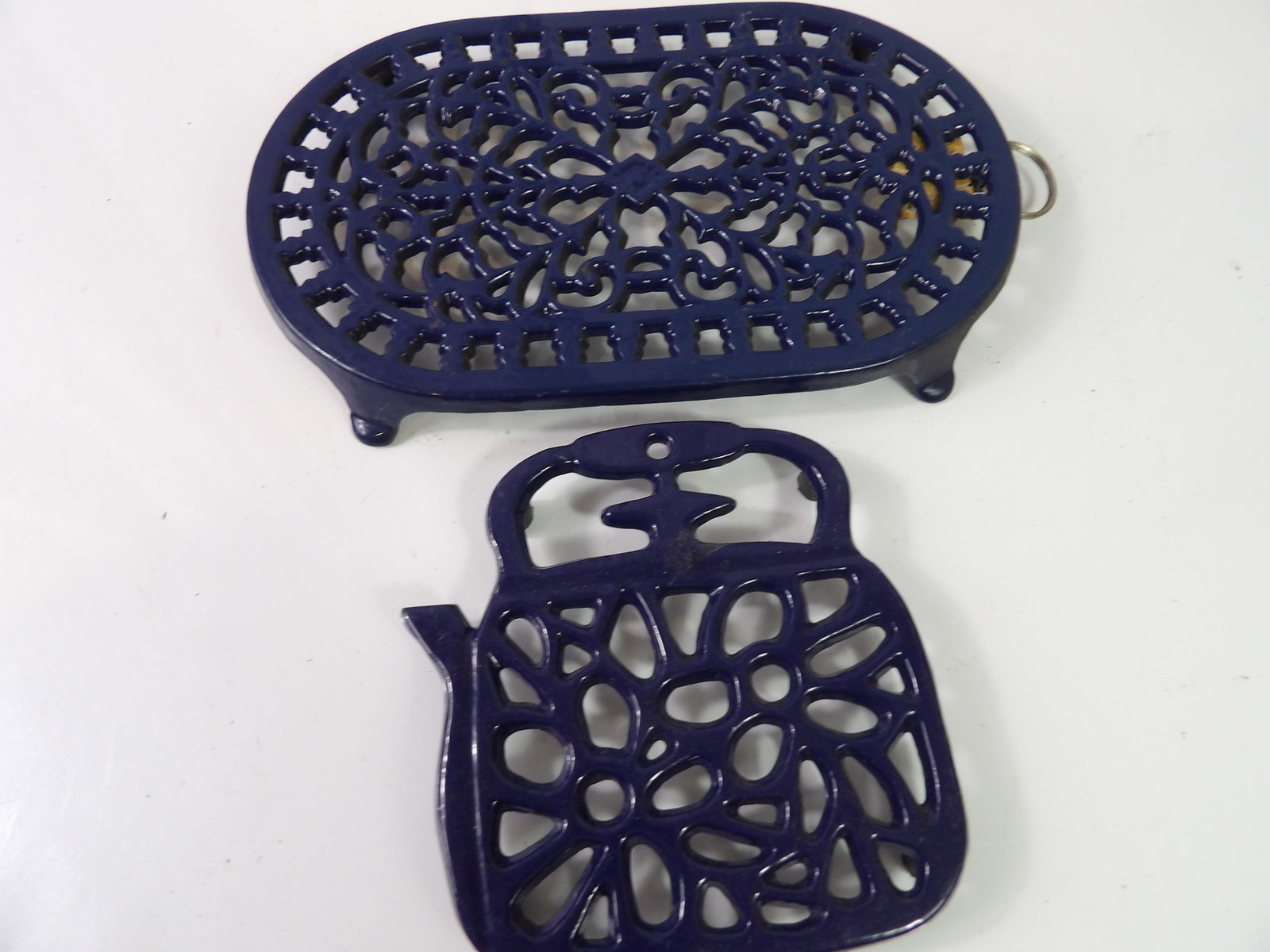 Pair of Blue Enamel Trivets: Pair of Blue Enamel Trivets. All measurements approximate. Please see photos for condition and details. Selling as is from 04281.