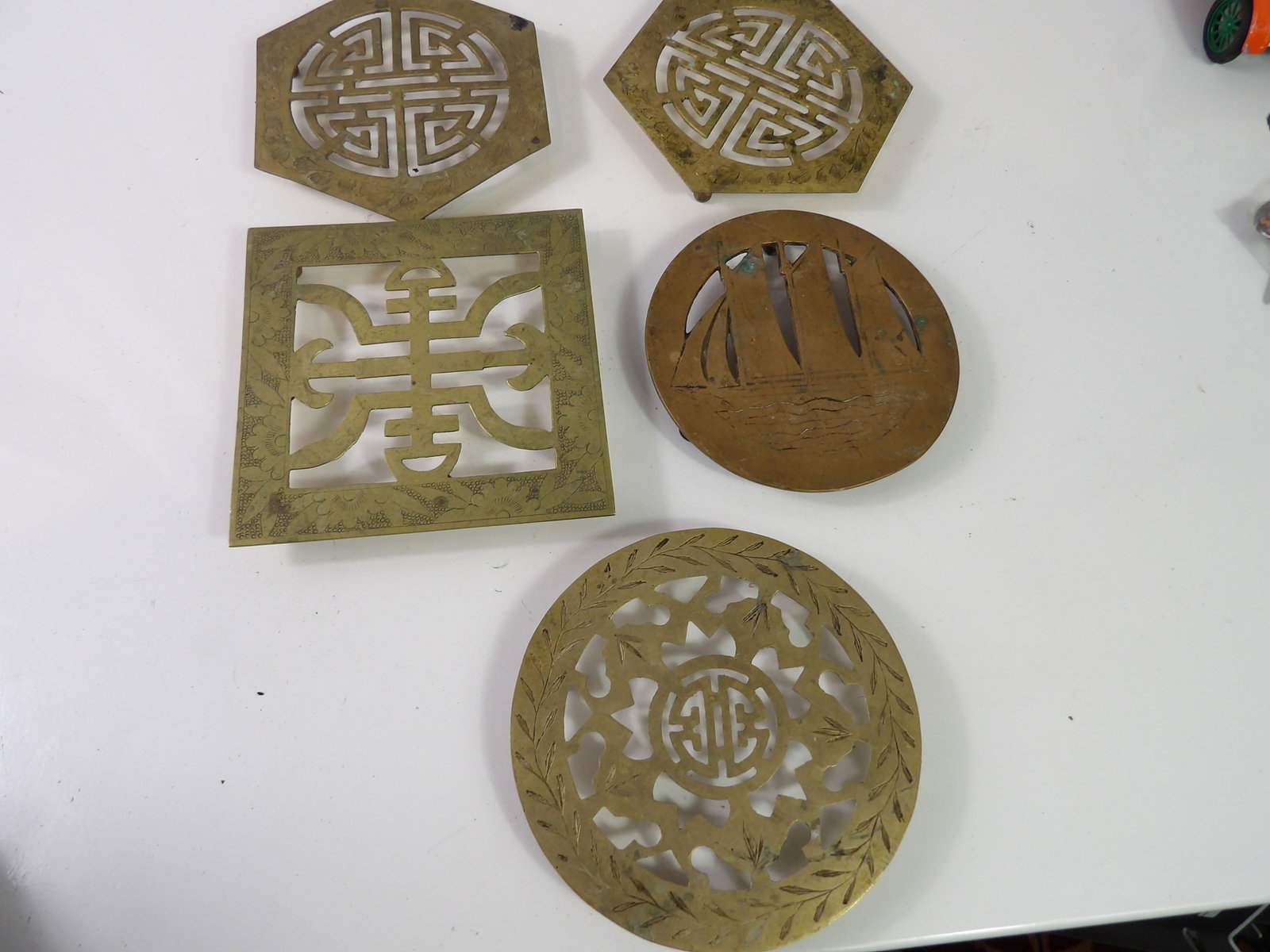 5 PCS.-Vintage Brass Trivets: Lot of 5 Vintage Brass Trivets. All measurements approximate. Please see photos for condition and details. Selling as is from 04281.