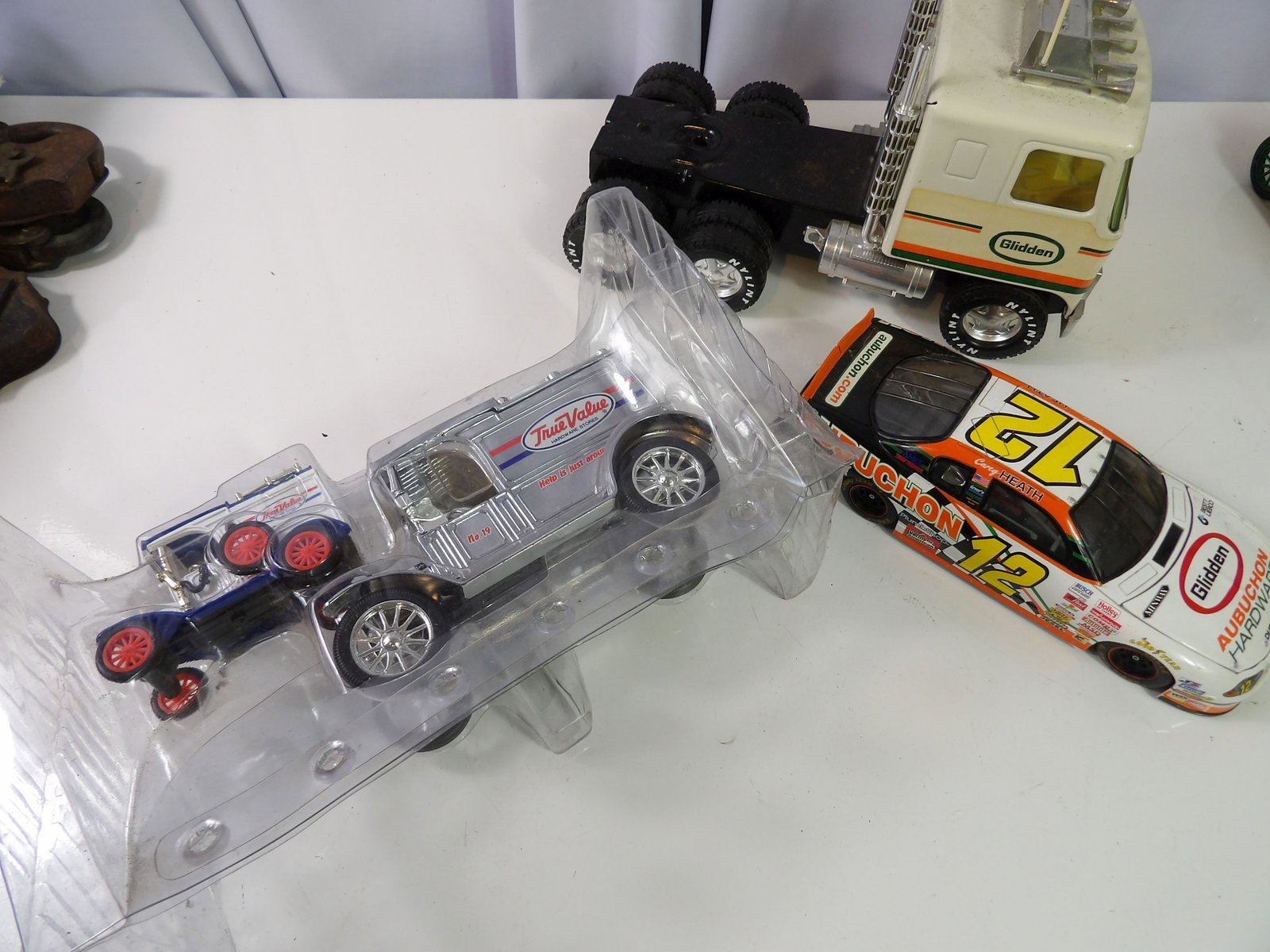 3 Large Aubuchon Hardware Die Cast and Plastic Toys: 3 Large Aubuchon Hardware Die Cast and Plastic Toys. All measurements approximate. Please see photos for condition and details. Selling as is from 04281.