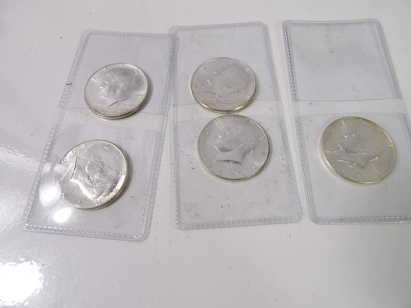 5 1964 Kennedy Silver Half-Dollars: 5 Kennedy Half-Dollars, 1964, Silver, Pristine Condition. All measurements approximate. Please see photos for condition and details. Selling as is from 04281.