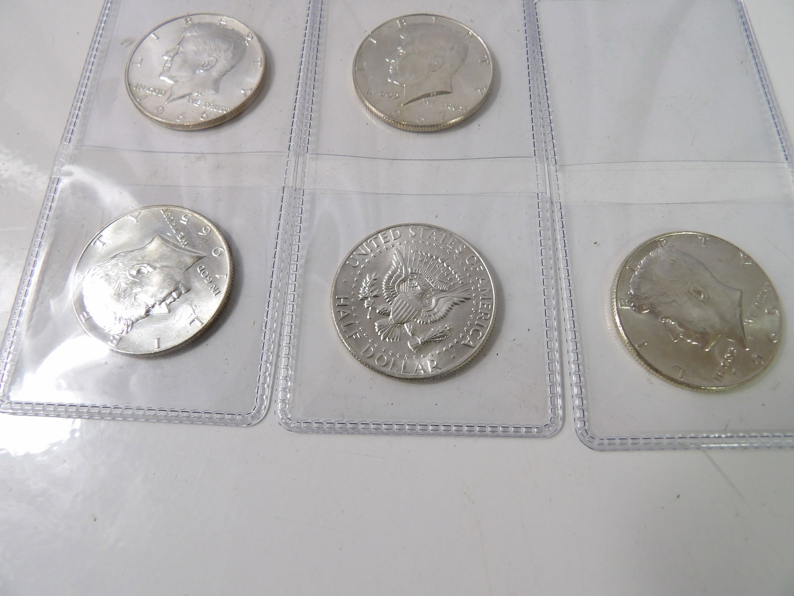 5 1965 - 1969 Kennedy Half-Dollars: 5 Kennedy Half-Dollars, 1965-1969, 41% Silver, Pristine Condition. All measurements approximate. Please see photos for condition and details. Selling as is from 04281.