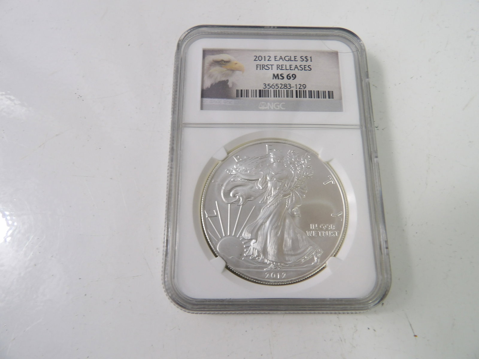 2012 Silver Eagle Bullion, First Releases, Slabbed & Graded by NGC: 2012 Silver Eagle First Releases, MS 69. Slabbed & Graded by NGC. All measurements approximate. Please see photos for condition and details. Selling as is from 04281.