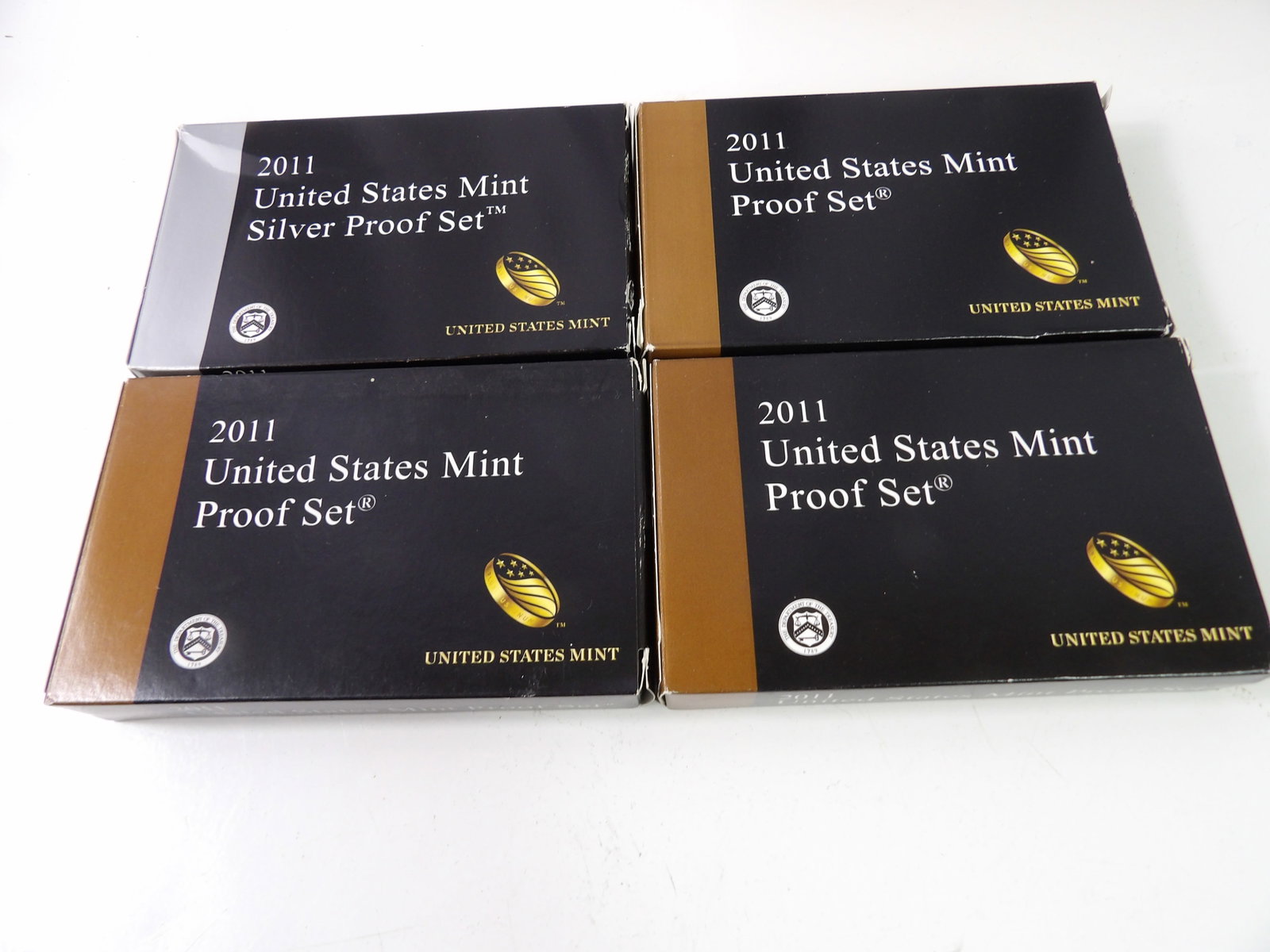 4 2011 U.S. Mint Proof Sets, 2 Silver: Set of 4, 2011 United States Mint Proof Sets, 2 Silver. All measurements approximate. Please see photos for condition and details. Selling as is from 04281.
