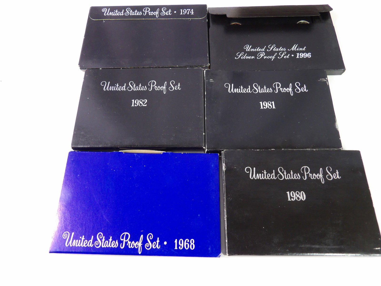 6 U.S. Mint Proof Sets, 1968, 1974, 1980, 1981, 1982, 1996: Set of 6 United States Mint Proof Sets. 1968, 1974, 1980, 1981, 1982, and 1996. The 1996 Set is a Silver Proof Set. All measurements approximate. Please see photos for condition and details. Selling