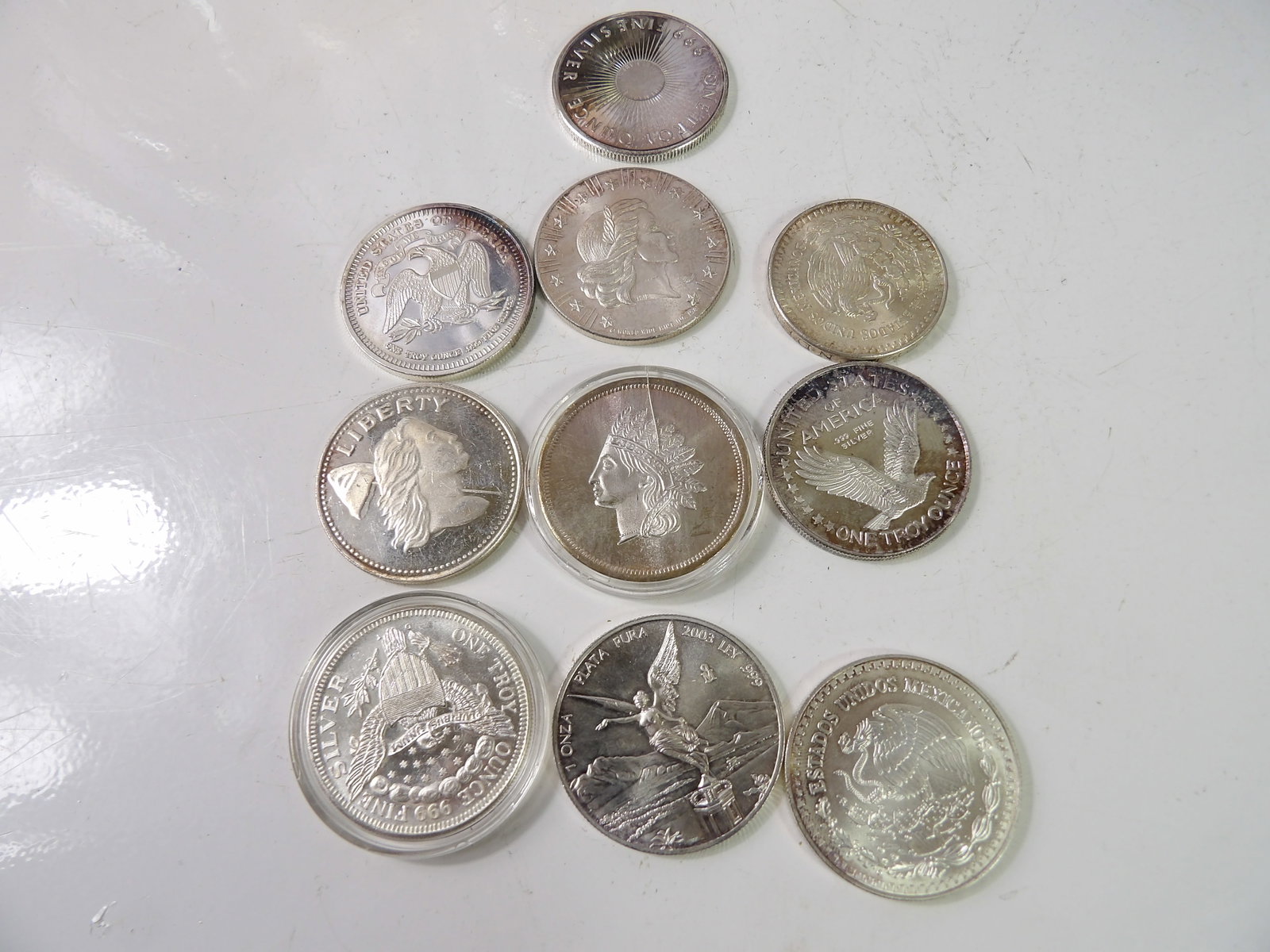10 1 Troy Oz. Pure Silver Rounds: Lot of 10, 1 Troy Oz. Pure Silver Rounds. All measurements approximate. Please see photos for condition and details. Selling as is from 04281.