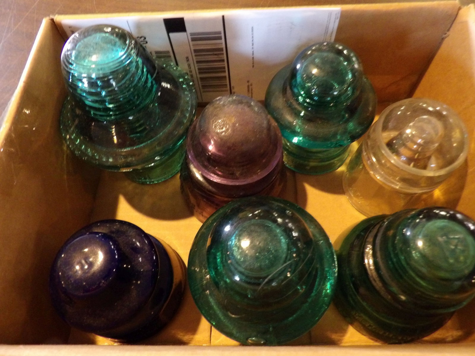 7 PCS.-Glass Insulators: Lot of 7 Glass Insulators. All measurements approximate. Please see photos for condition and details. Selling as is from 04281.