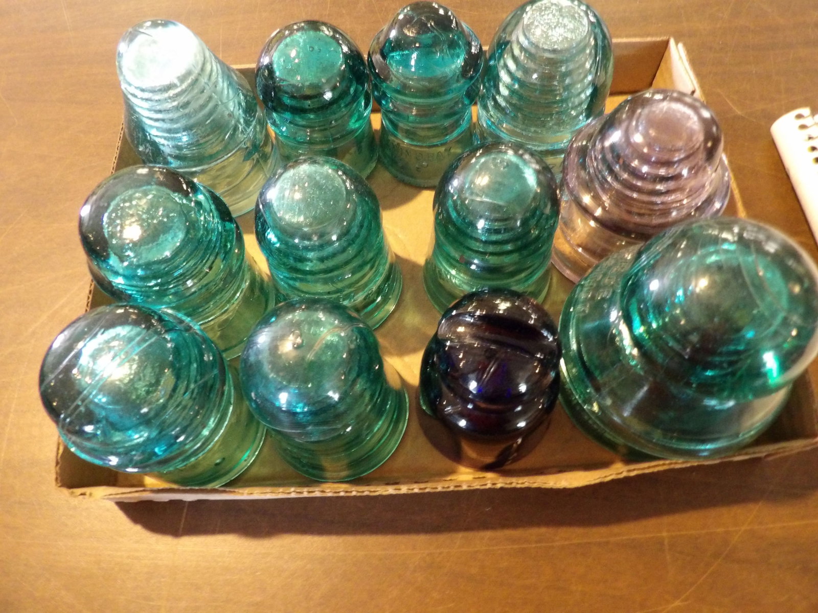 12 PCS.-Glass Insulators: Lot of 12 Glass Insulators. All measurements approximate. Please see photos for condition and details. Selling as is from 04281.