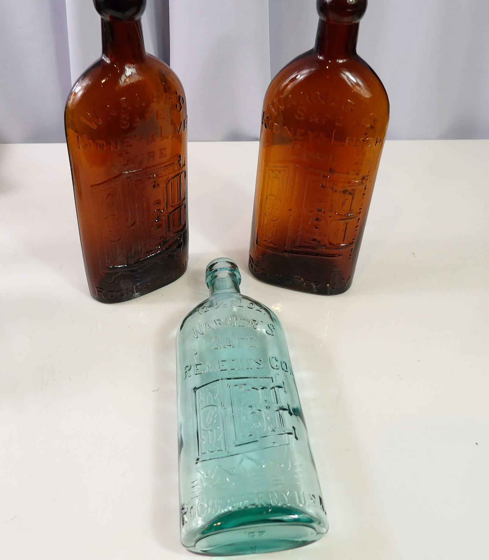 3 Warner's Safe Kidney & Liver Cure Medicine Bottles: Collection of 3 Antique Warner's "Safe Kidney and Liver Cure" Medicine Bottles. All measurements approximate. Please see photos for condition and details. Selling as is from 04281.