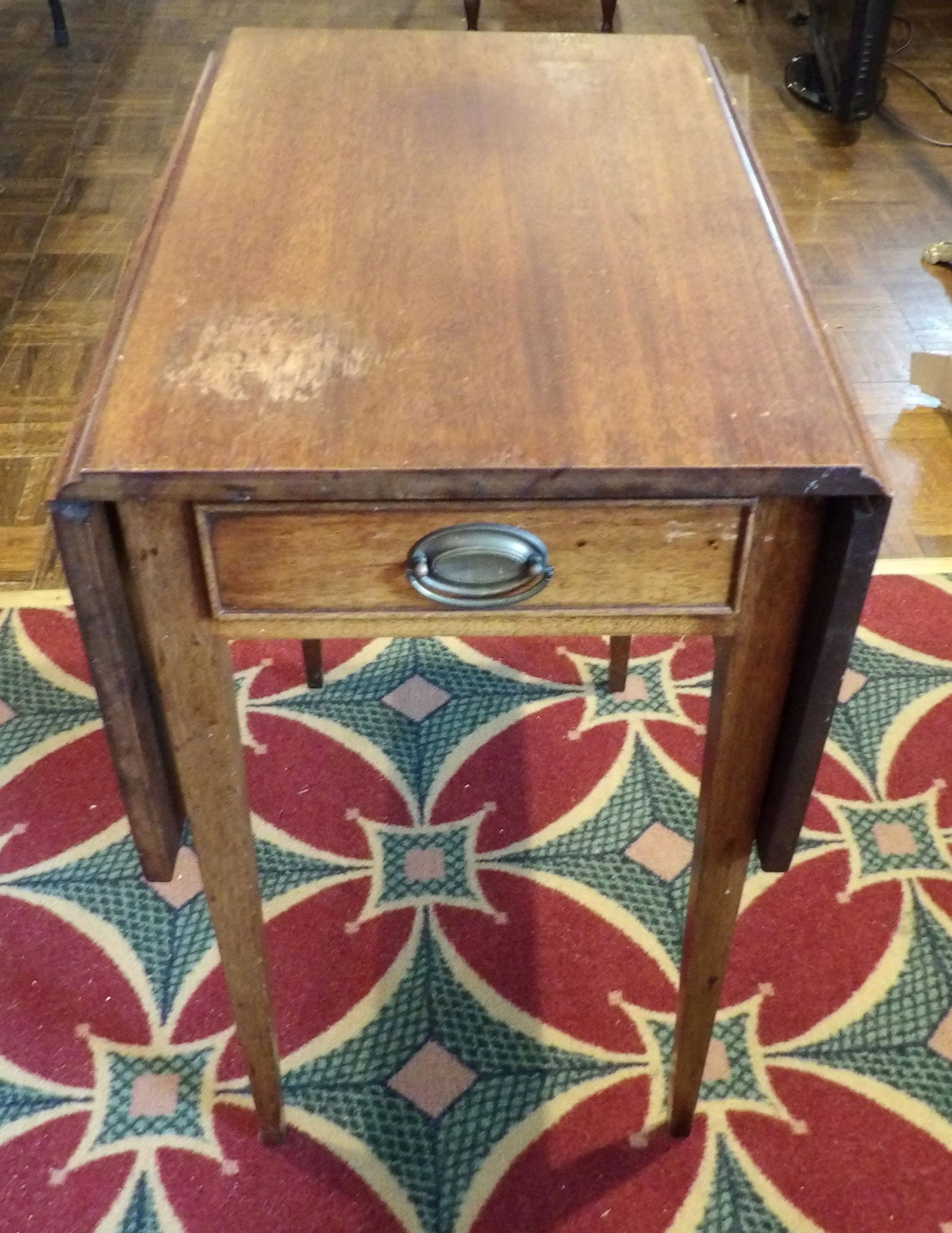 Vintage Drop Leaf Side Table: Vintage Drop Leaf Side Table with Single Drawer and Oval Brass Pull. All measurements approximate. Please see photos for condition and details. Selling as is from 04281.