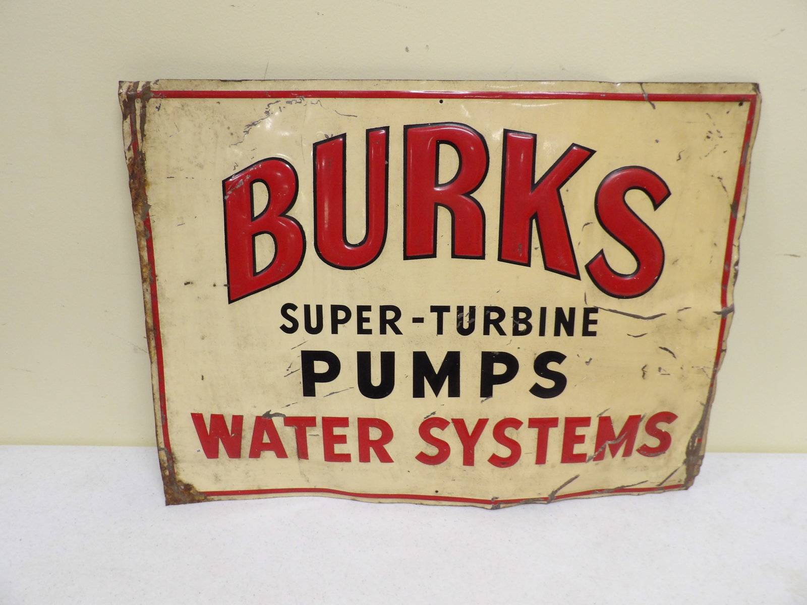 Early Metal Burke's Super Turbine Pumps Sign: 17" X 23" Early Metal Burk's Super Turbine Pumps Water System Advertising Sign. All measurements approximate. Please see photos for condition and details. Selling as is from 04281.