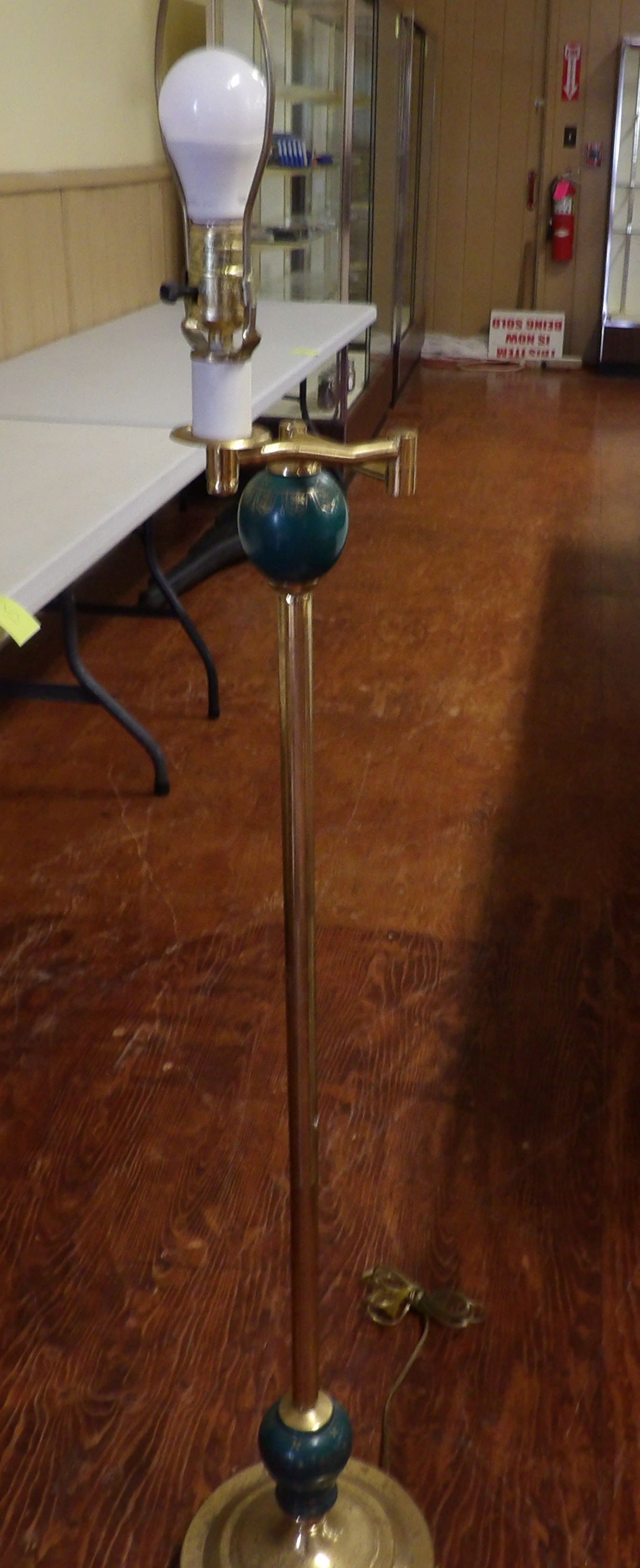 Vintage Brass Floor Lamp with Green Accent: Vintage Brass Floor Lamp with Green Accent and Round Base. All measurements approximate. Please see photos for condition and details. Selling as is from 04281.