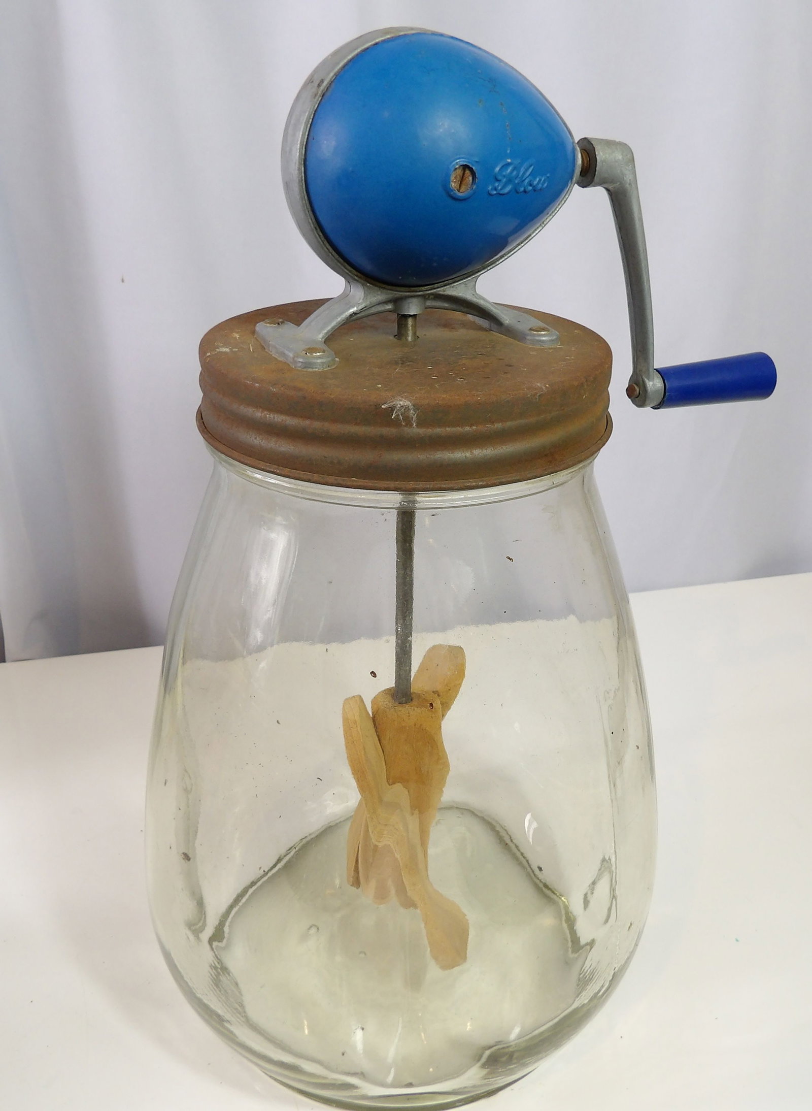 Vintage Blow Butter Churn: Vintage Blow Butter Churn with Blue Handle and Wooden Paddle. All measurements approximate. Please see photos for condition and details. Selling as is from 04281.