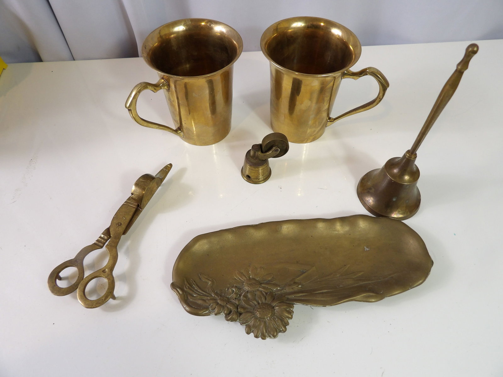 Vintage Brass Lot: Vintage Brass Lot. Cups, Candle Cutter, Bell, and Tray. All Excellent Condition. All measurements approximate. Please see photos for condition and details. Selling as is from 04281.