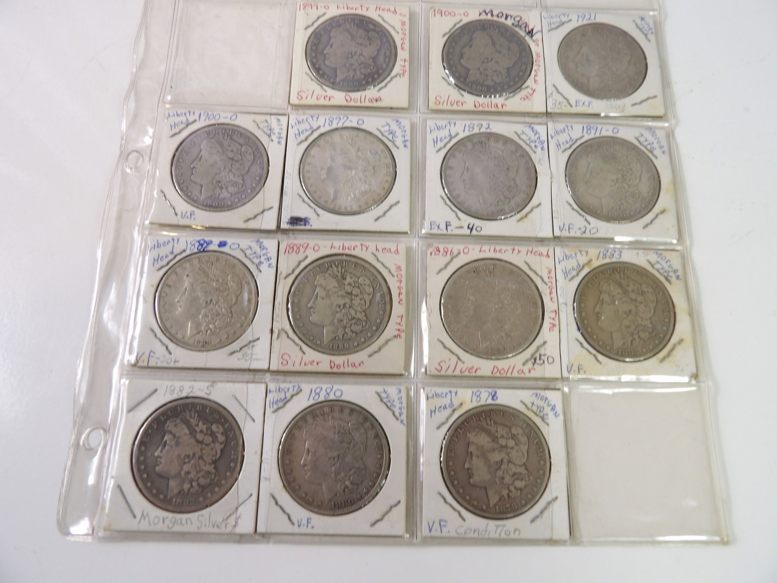 14 PCS.- Early Morgan Dollars: Lot of 14 Early Morgan Dollars. All measurements approximate. Please see photos for condition and details. Selling as is from 04281.