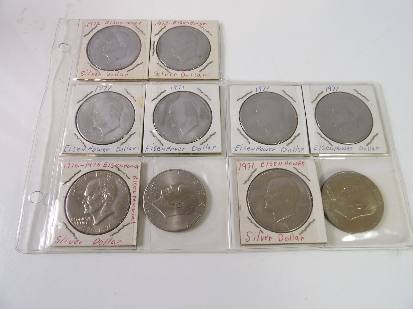 10 Eisenhower Dollars, 1971, 1972 & Bicentennial: Lot of 10 Eisenhower Dollars. 1971, 1972, and Bicentennial. All measurements approximate. Please see photos for condition and details. Selling as is from 04281.