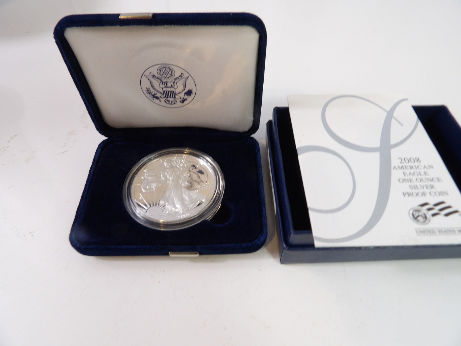 2008 Silver Eagle Bullion: 2008 American Silver Eagle with Case and COA. All measurements approximate. Please see photos for condition and details. Selling as is from 04281.