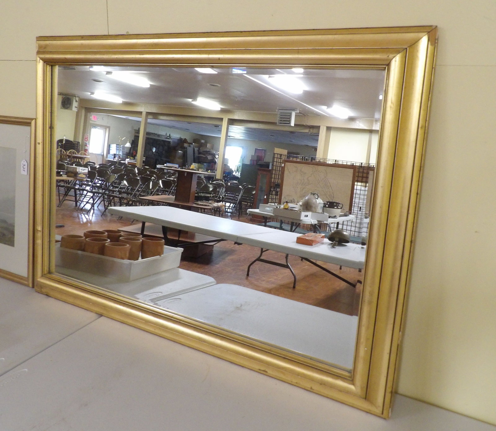Glided Frame Beveled Glass Wall Mirror: 30" X 41" Gilded Framed Beveled Glass Wall Mirror. Frame is Solid. (Has a couple small chips, hardly noticeable). All measurements approximate. Please see photos for condition and details. Selling as