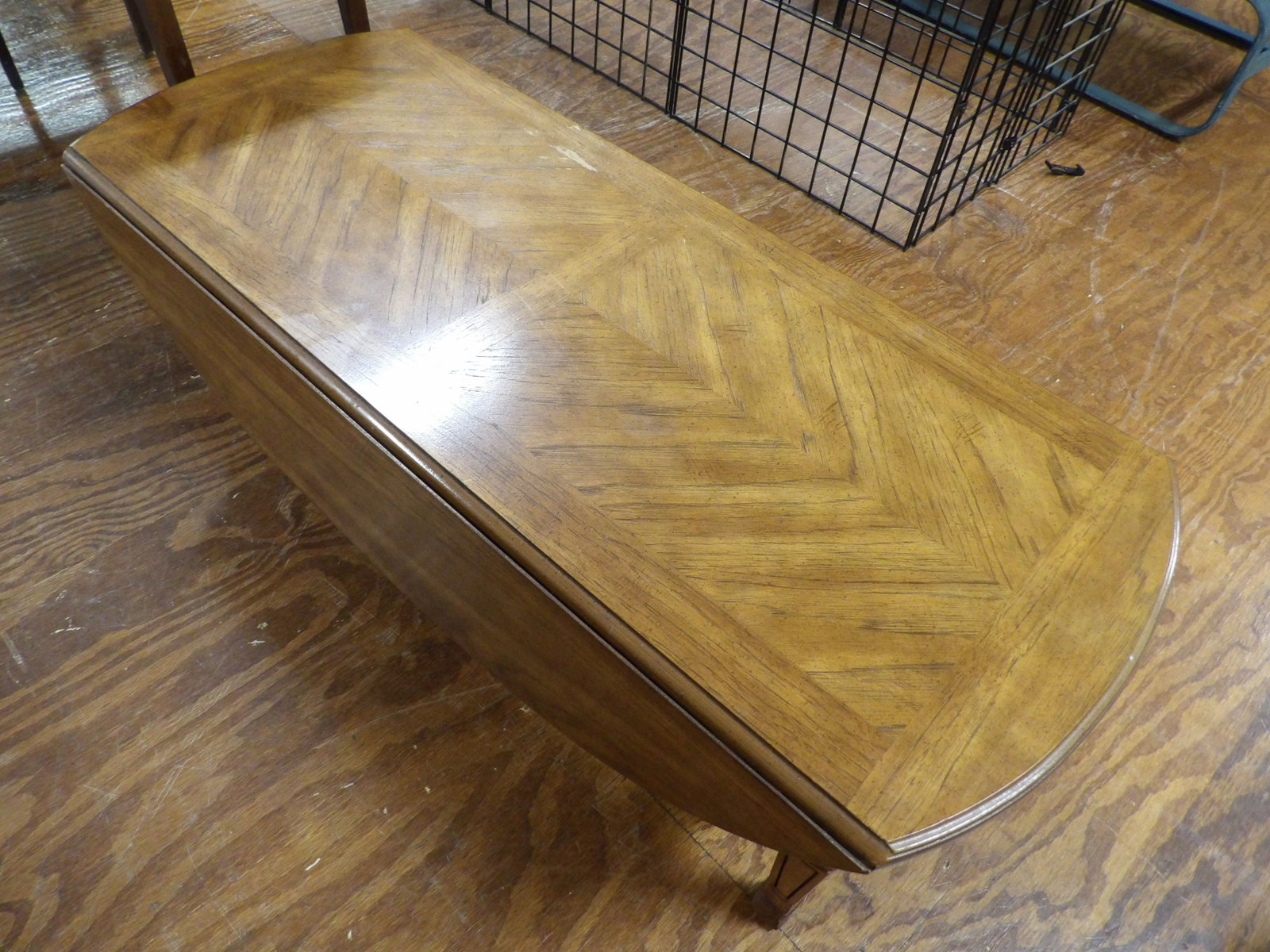 Mid-Century Modern Drop Leaf Coffee Table: Mid-Century Modern Drop Leaf Coffee Table. Herringbone Design Top. All measurements approximate. Please see photos for condition and details. Selling as is from 04281.