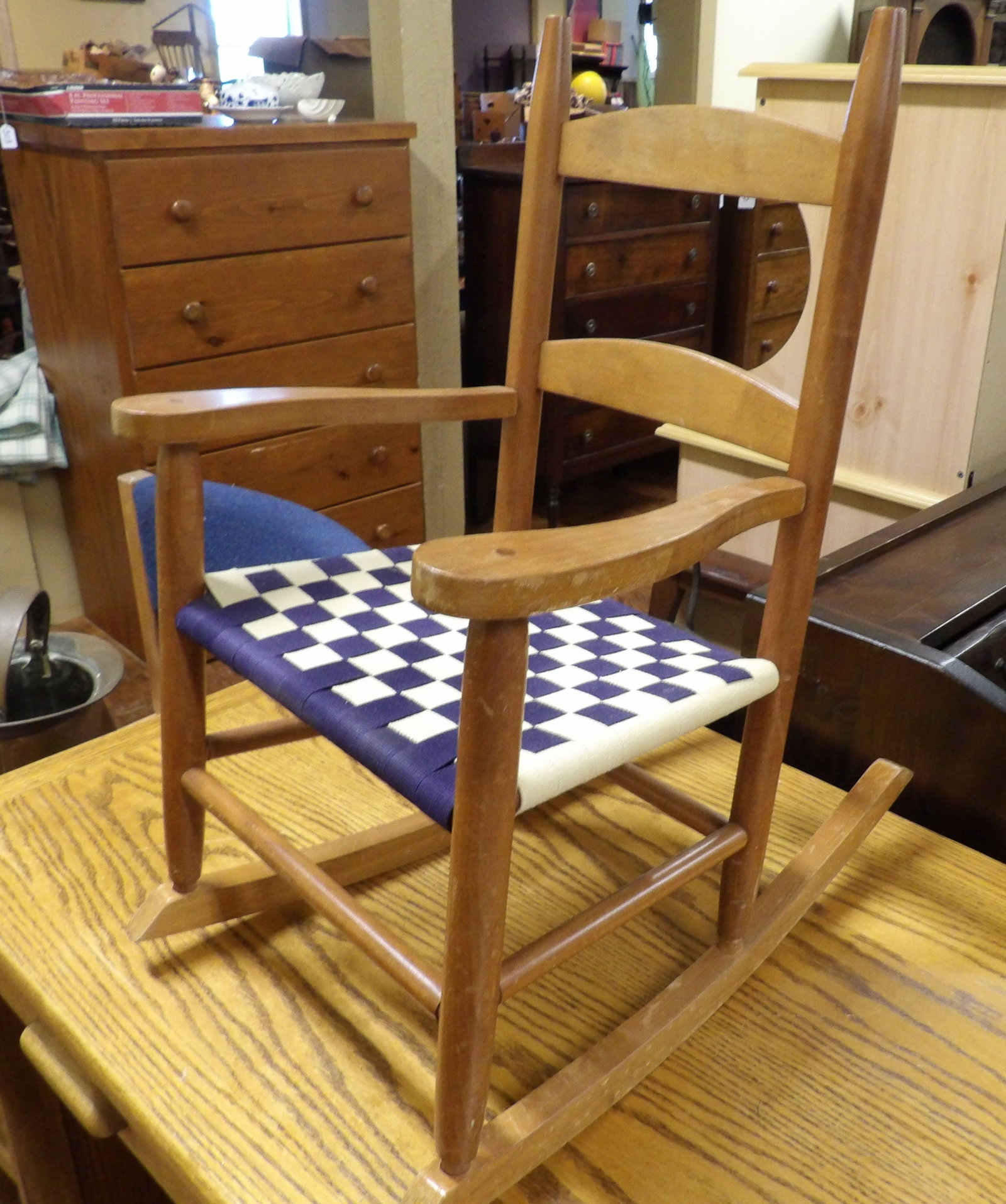 Mini Shaker Style Rocking Chair: Mini Shaker Style Rocking Chair. Woven Blue and White Checkerboard Seat. All measurements approximate. Please see photos for condition and details. Selling as is from 04281.