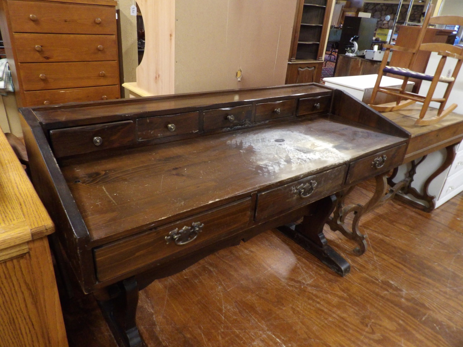 Vintage Trestle Desk: Vintage Dark Trestle Desk with Colonial Style Details. All measurements approximate. Please see photos for condition and details. Selling as is from 04281.