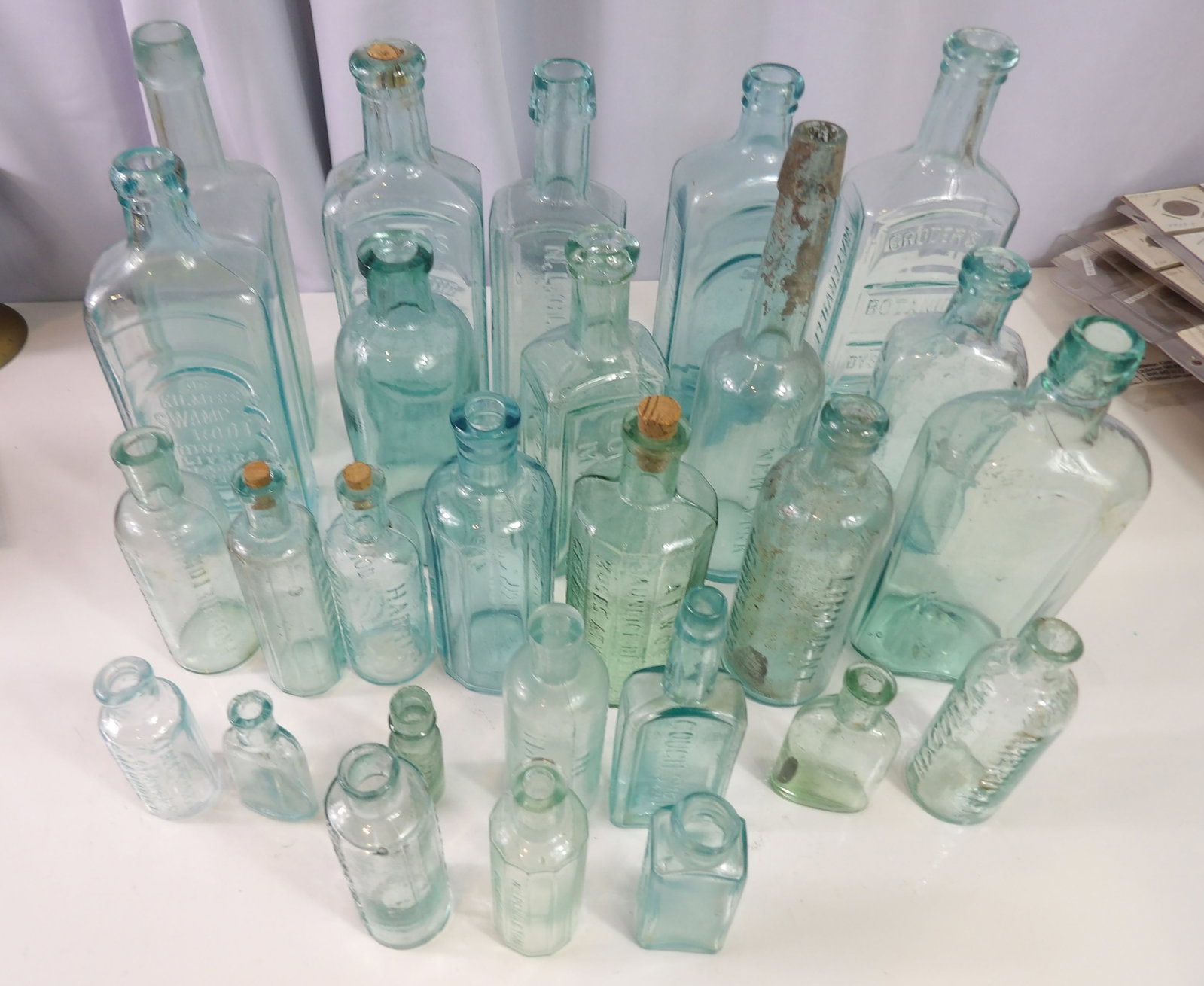 27 PCS.-Apothecary and Medicine Bottles: Large Lot of 27 Early Apothecary and Quirky Medicine Bottles. All Blue/Green Tint. All measurements approximate. Please see photos for condition and details. Selling as is from 04281.