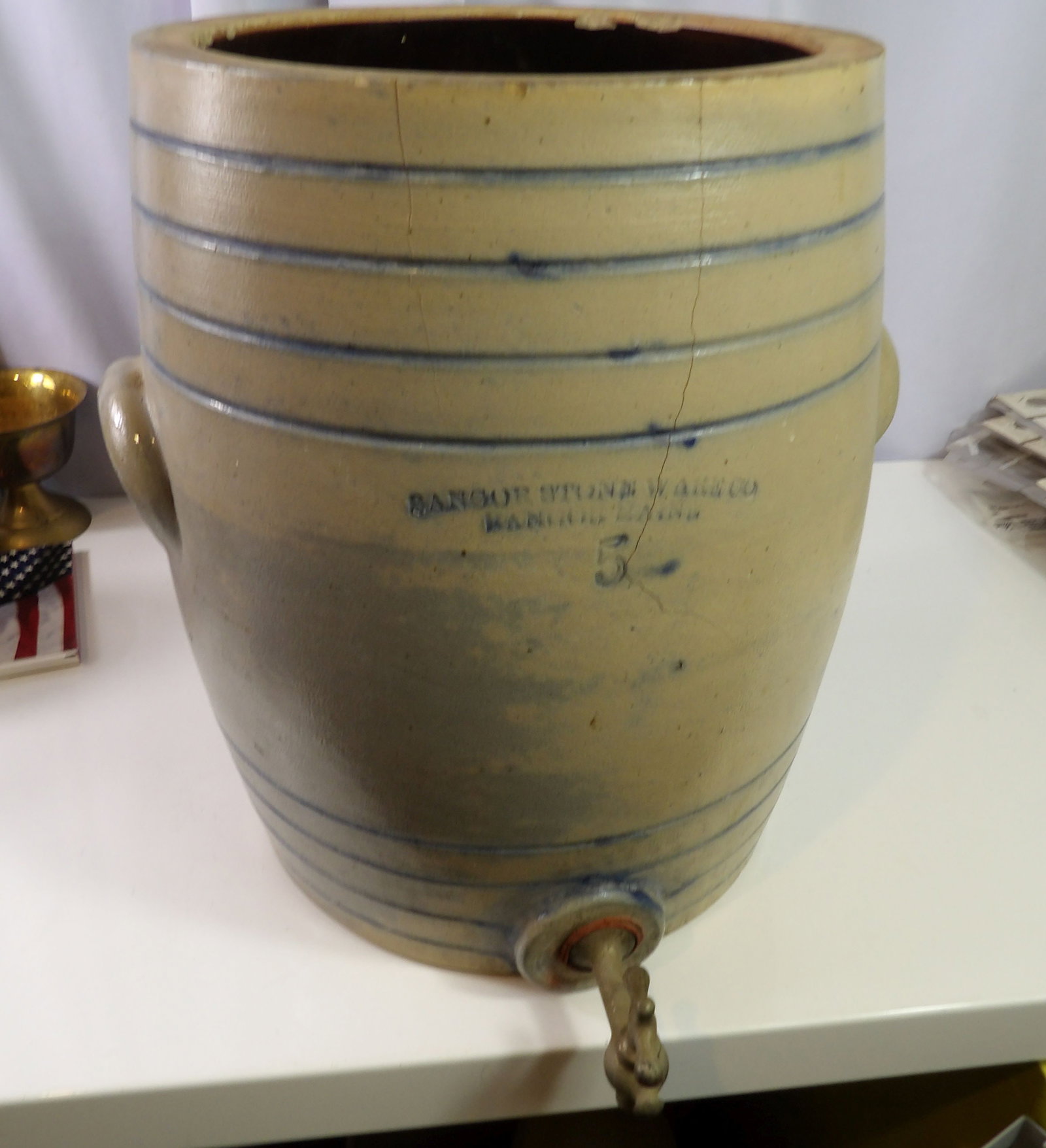 Vintage Bangor Stoneware Company 5 Gallon Water Cooler: Vintage Bangor Stoneware Company, 5 Gallons Water Cooler with Spigot. Cover is Missing. (Crock has a couple cracks.) All measurements approximate. Please see photos for condition and details. Selling