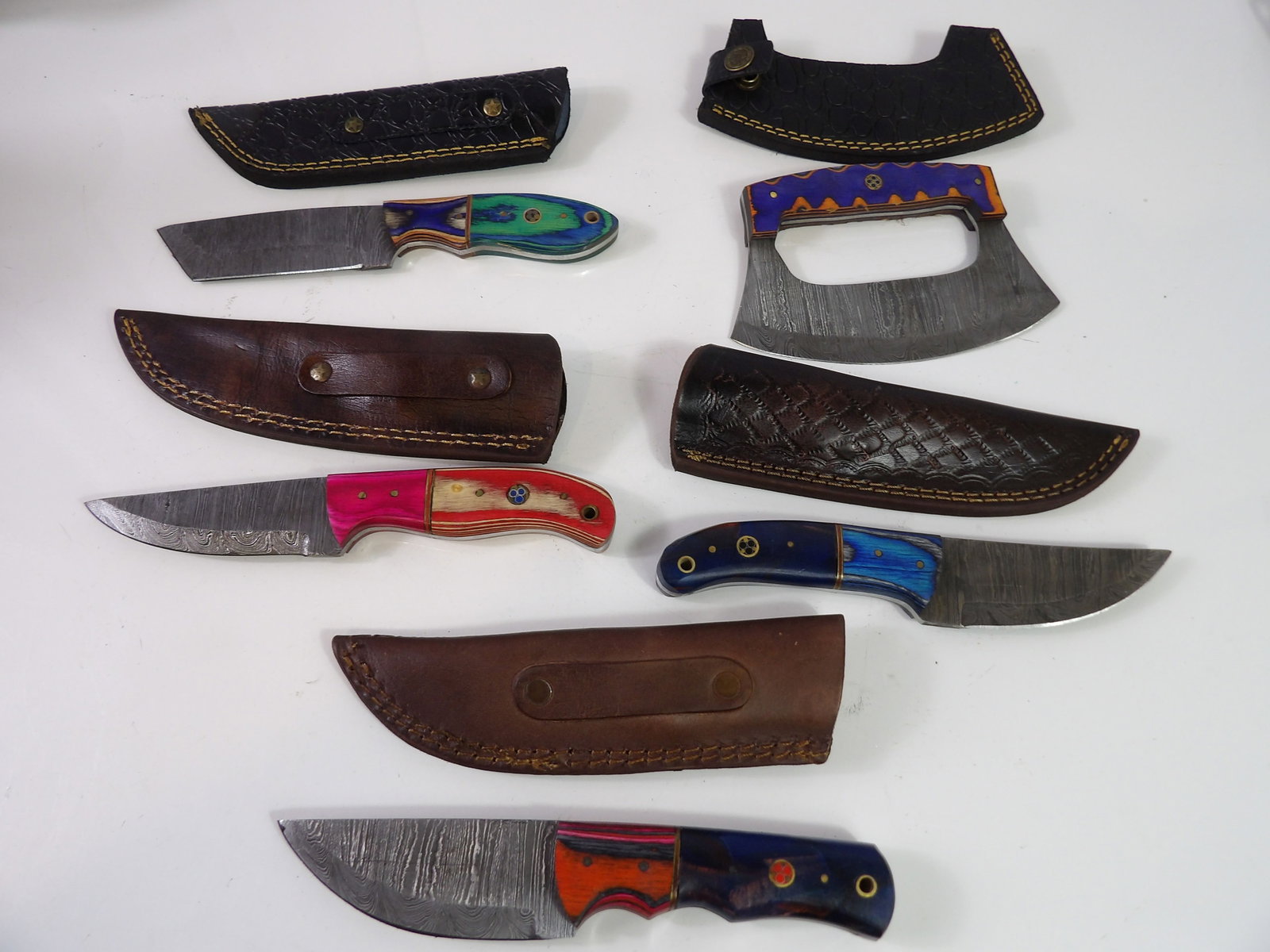 5 Handmade Damascus Steel Knives With Sheaths: Lot of 5 New Handmade Damascus Steel Knives with Leather Sheaths. All measurements approximate. Please see photos for condition and details. Selling as is from 04281.