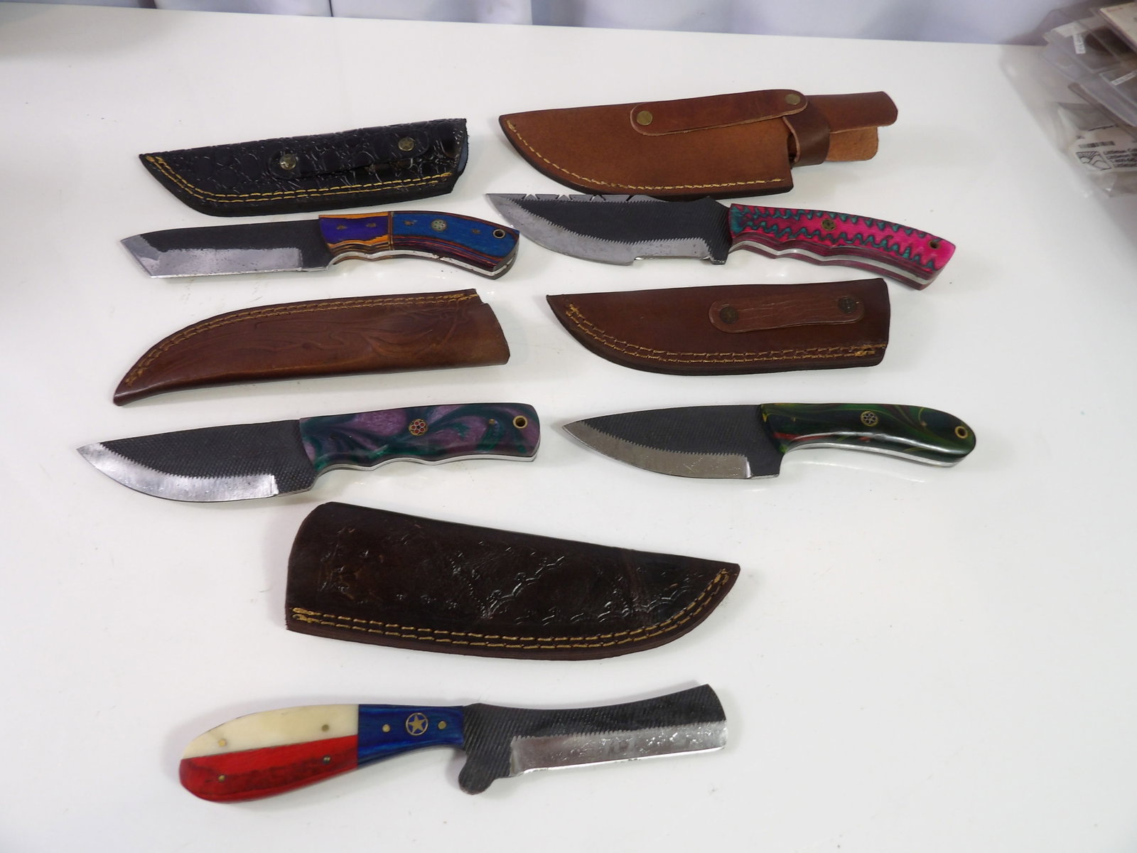 5 Handmade Damascus Steel Knives With Sheaths: Lot of 5 New Handmade Damascus Steel Knives with Leather Sheaths. All measurements approximate. Please see photos for condition and details. Selling as is from 04281.