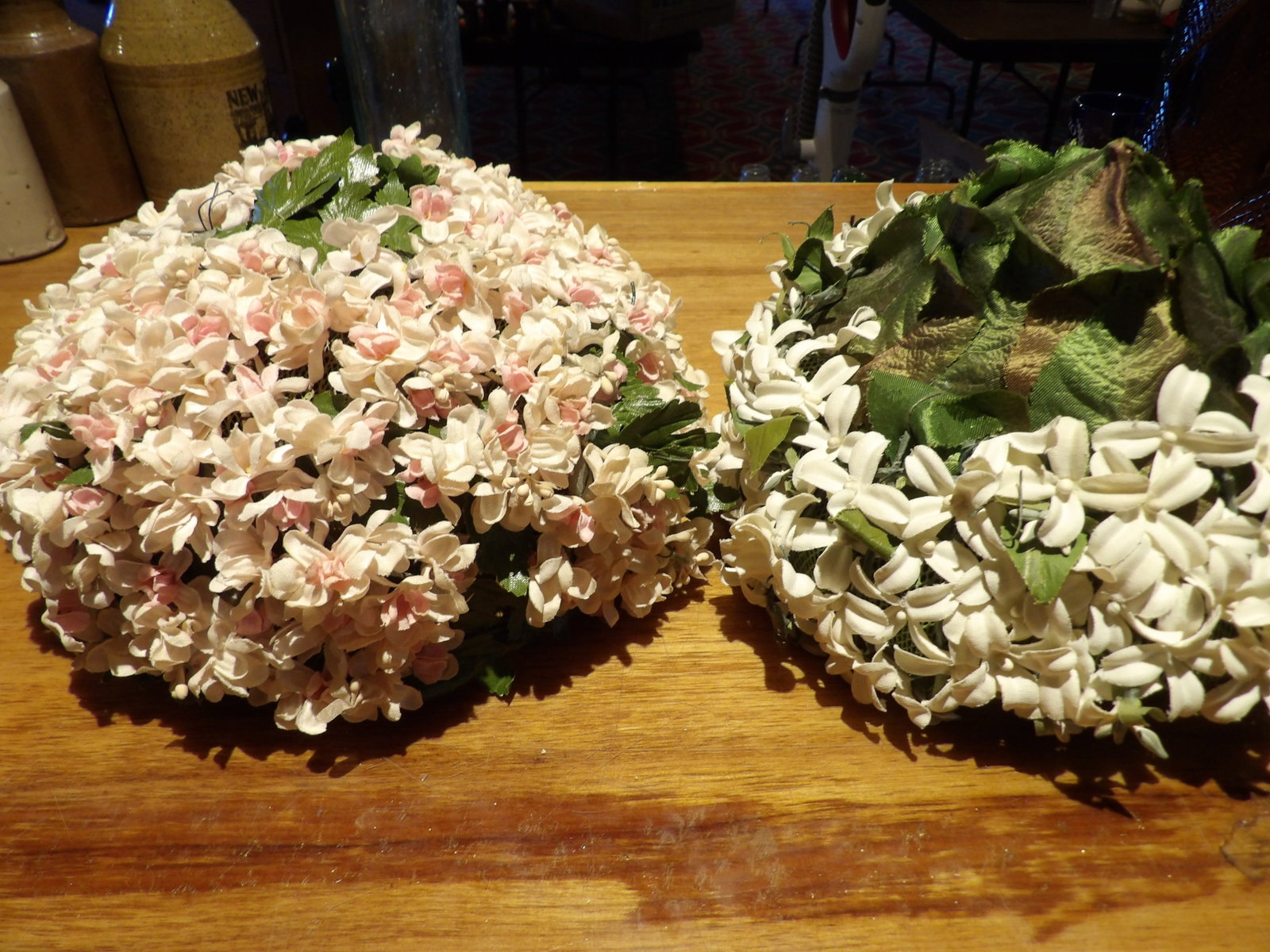 Pair of Vintage Floral Hats: Pair of Vintage Floral Hat Forms with Decorative Floral Arrangements. All measurements approximate. Please see photos for condition and details. Selling as is from 04281.