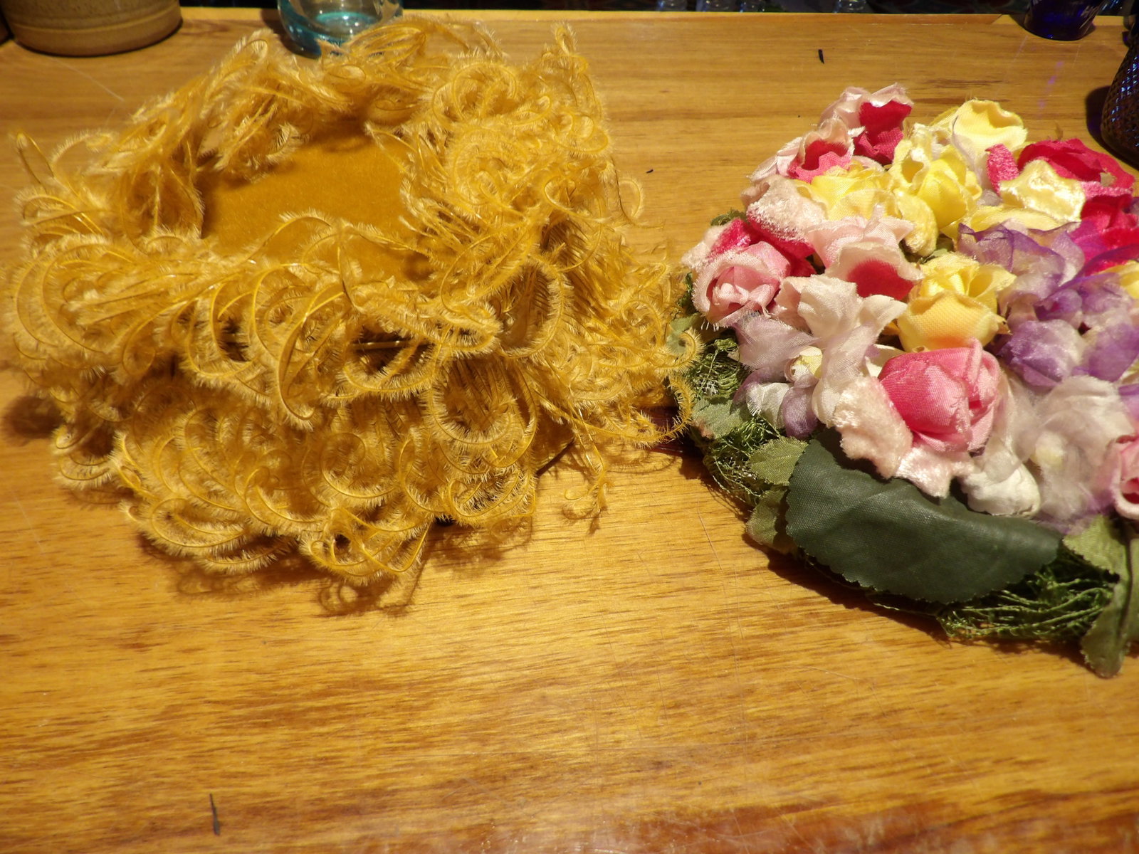 Pair of Vintage Hats: Pair of Vintage Hats. One with Spun Tinsel, One with Flowers. All measurements approximate. Please see photos for condition and details. Selling as is from 04281.