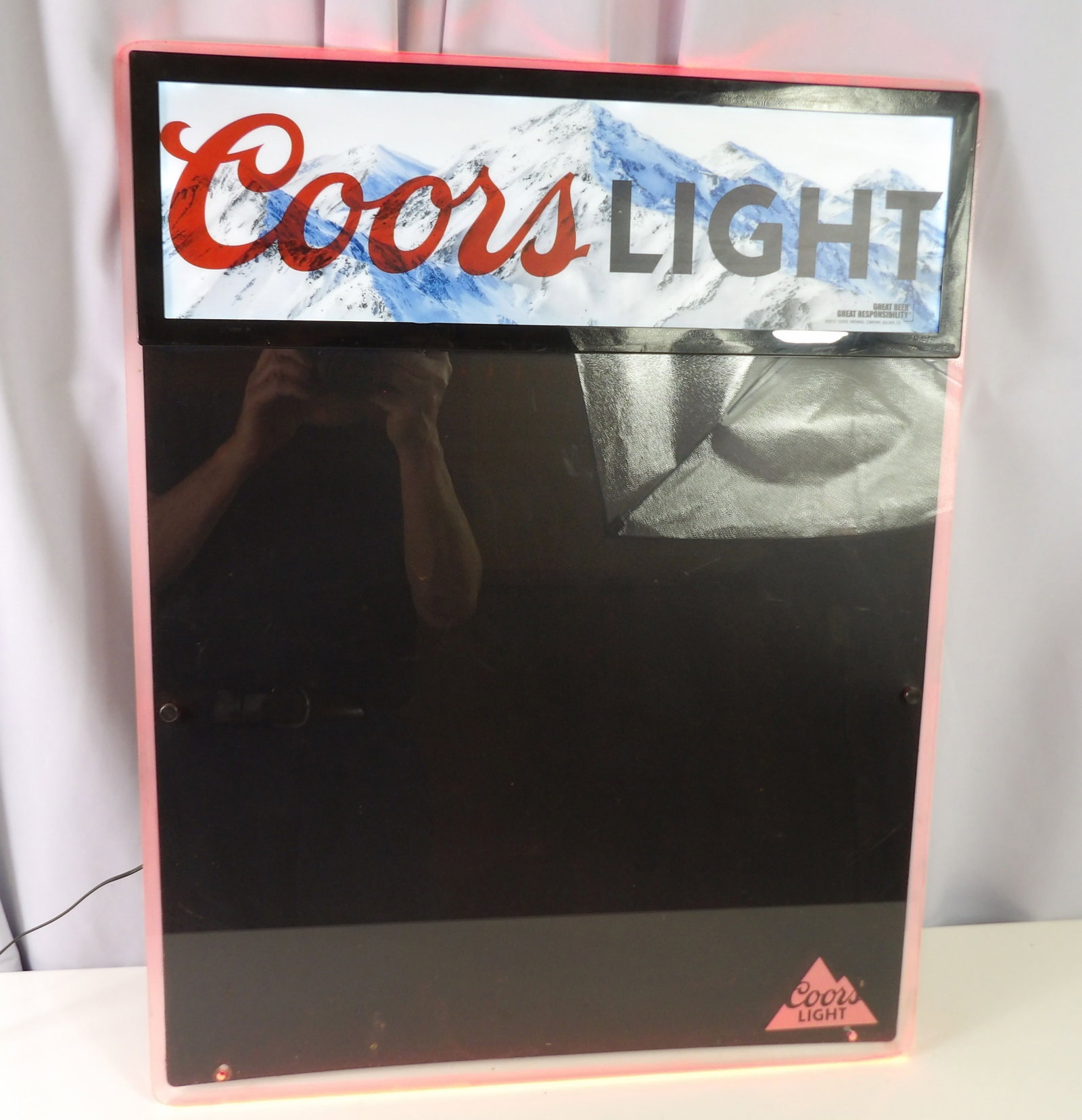Coors Light Illuminated Dry Erase Board: Coors Light Illuminated Dry Erase Board. 19" X 24" Frame. Changes Colors Every Few Seconds. All measurements approximate. Please see photos for condition and details. Selling as is from 04281.